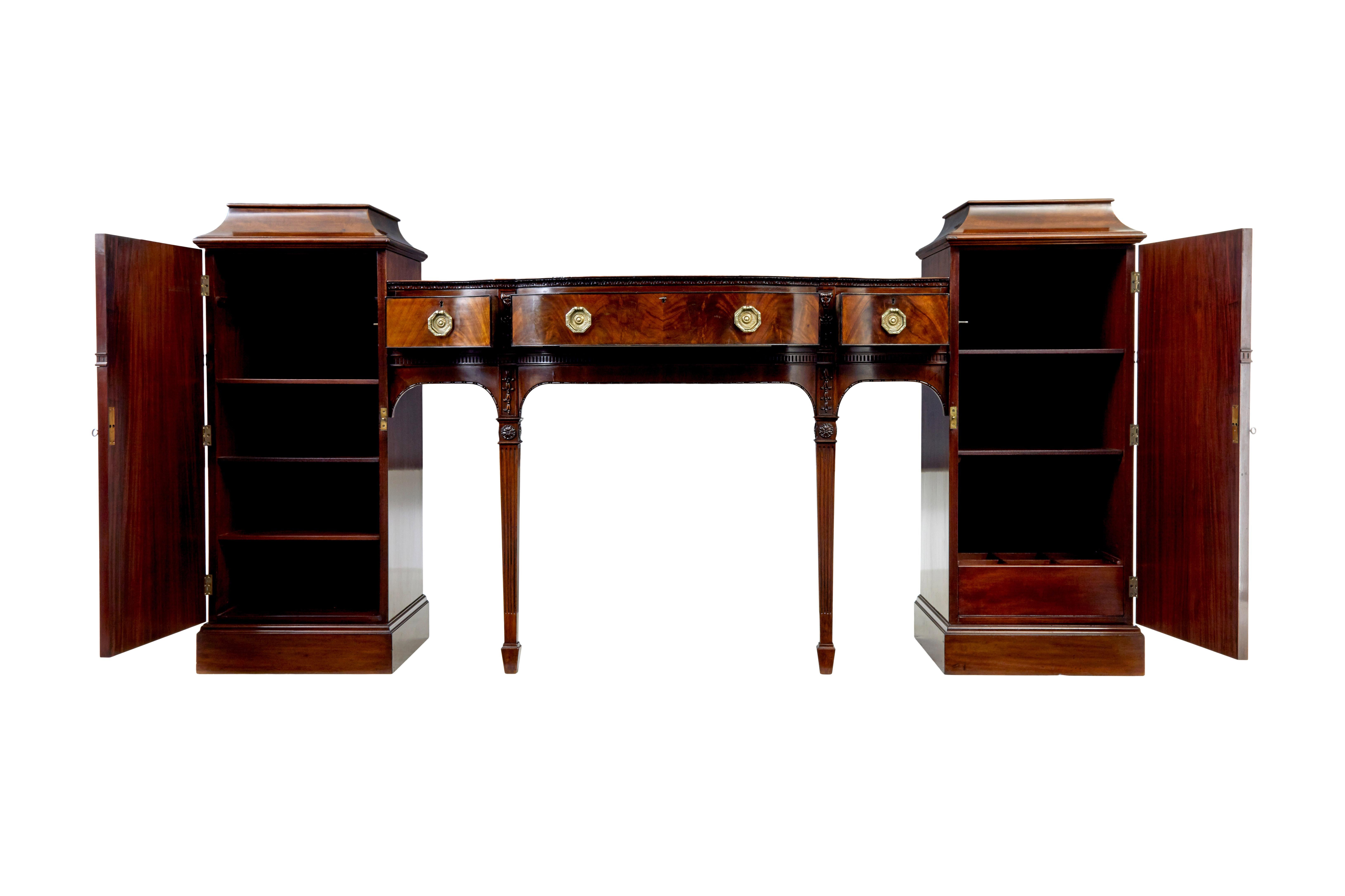 19th century adams revival carved mahogany pedestal sideboard circa 1880.

Comprising of 3 parts which fit together with dowel and screw.  Carved and decorated with applied swags and florals in the adams style.
Right hand pedestal with 2 shelves and