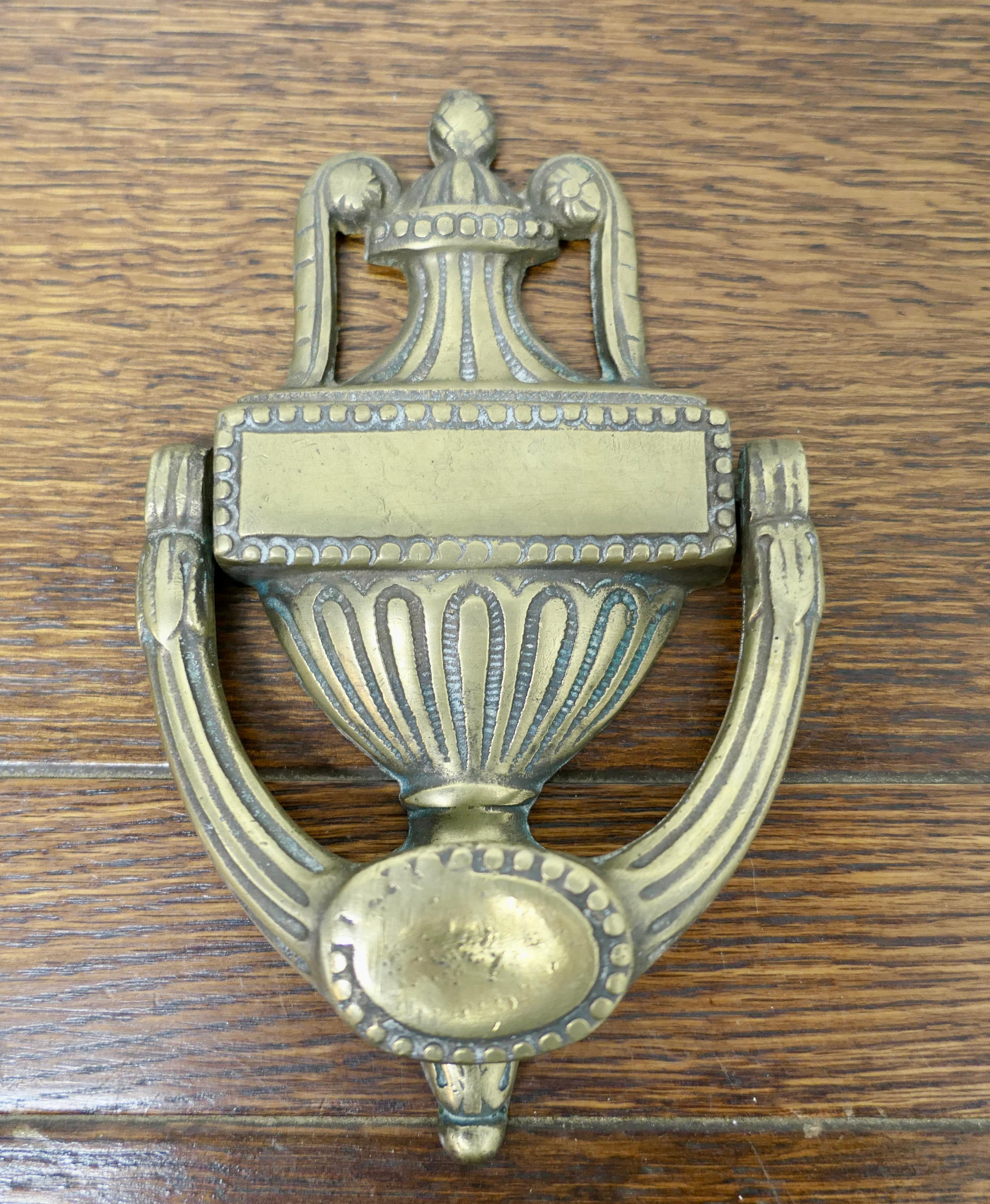 19th century Adams style brass urn and cover door knocker,

A large Victorian brass door knocker decorated with a classic Urn and cover, this a one piece Knocker
The door knocker measures 8” high x 5” wide and 1.5” deep
WD122.