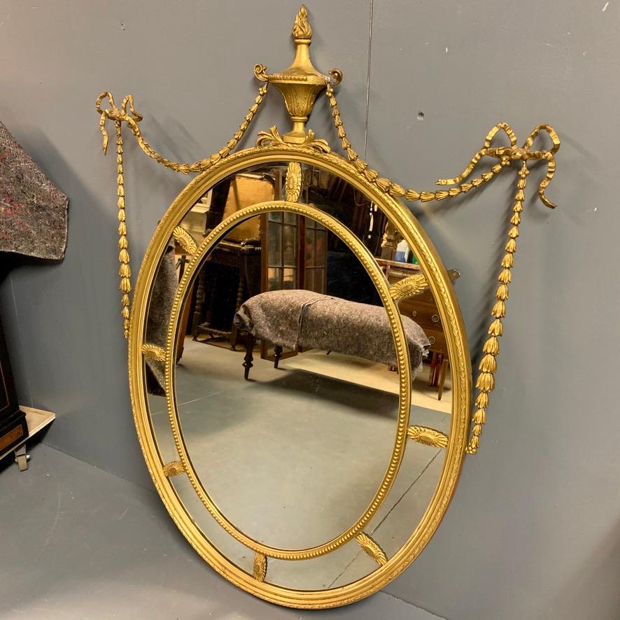 Adam Style 19th Century Adams Style Oval Gilt Mirror with Tied Ribbons and Urn Decor