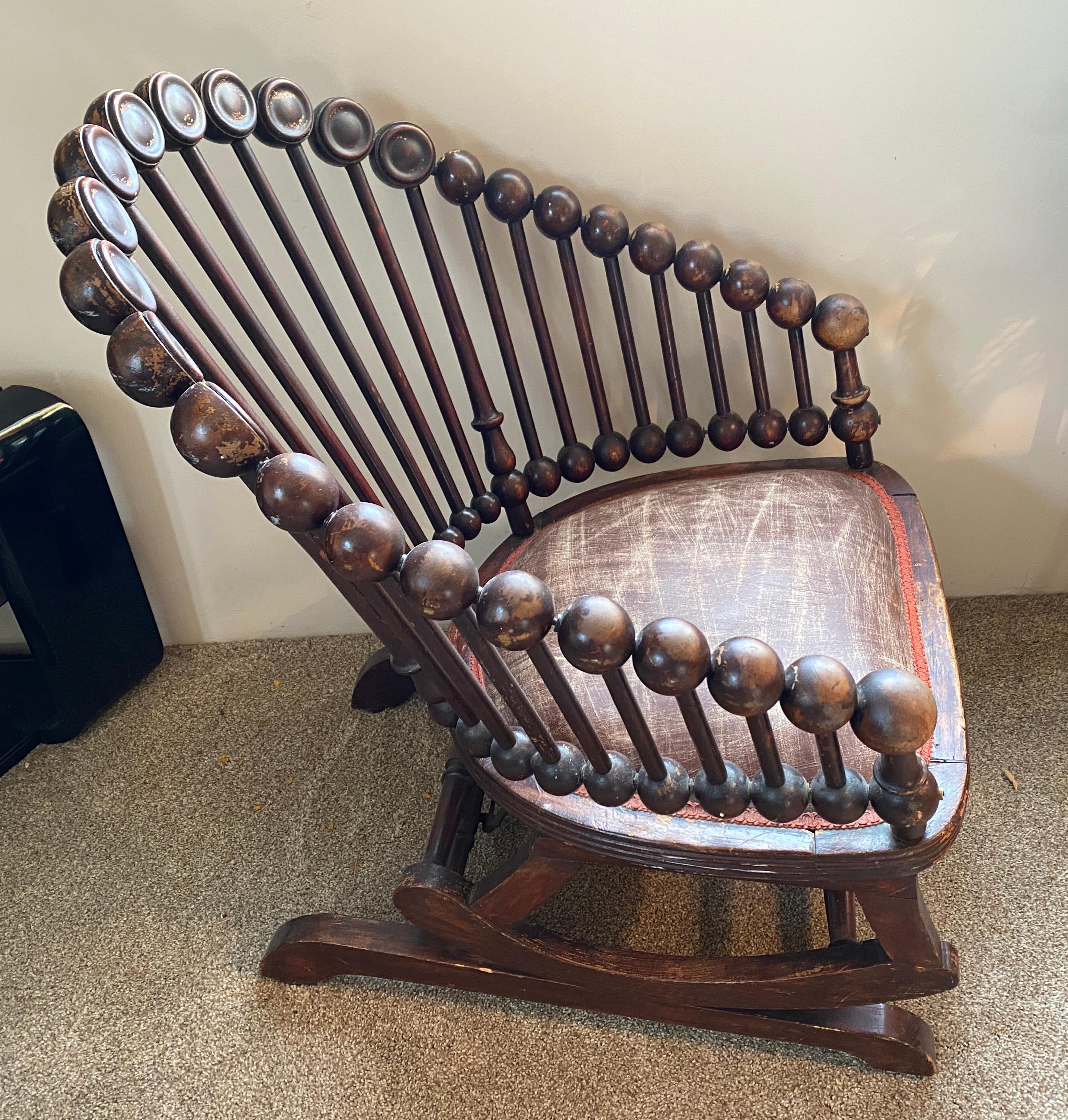 Store closing March 31.  Rare and phenomenal George Hunzinger lollipop rocking chair, circa 1885. The first stationery rocker ever. Carved and lacquered wood, enameled steel, upholstery, brass. The lollipop chair was a defining expression of the