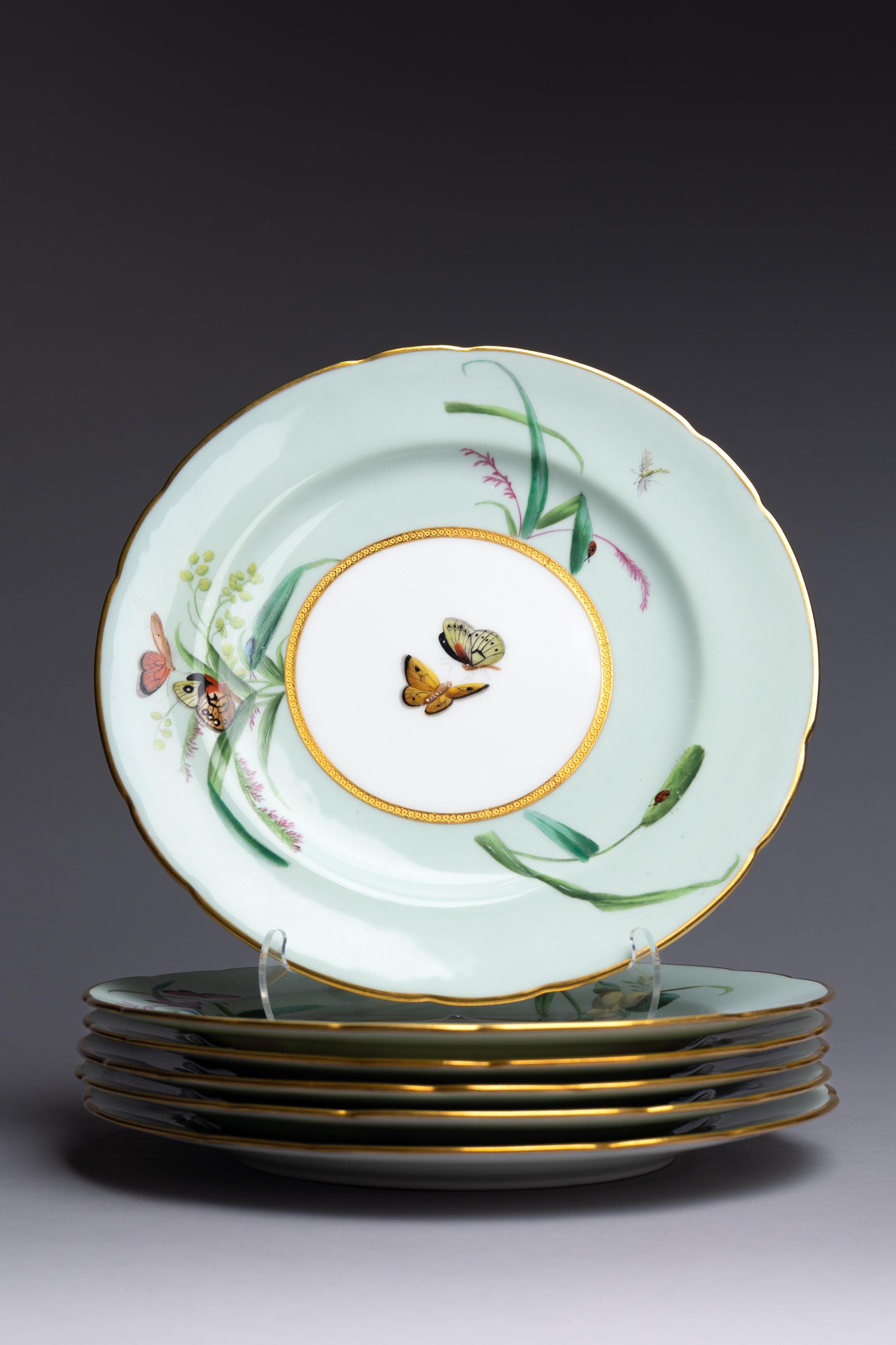 A set of 12 dinner plates and 3 cake stands by Minton from 1874 featuring mint green borders and beautifully hand-painted butterflies.

The 1874 production of these Minton dinner plates corresponds with the beginnings of the factory’s Aesthetic