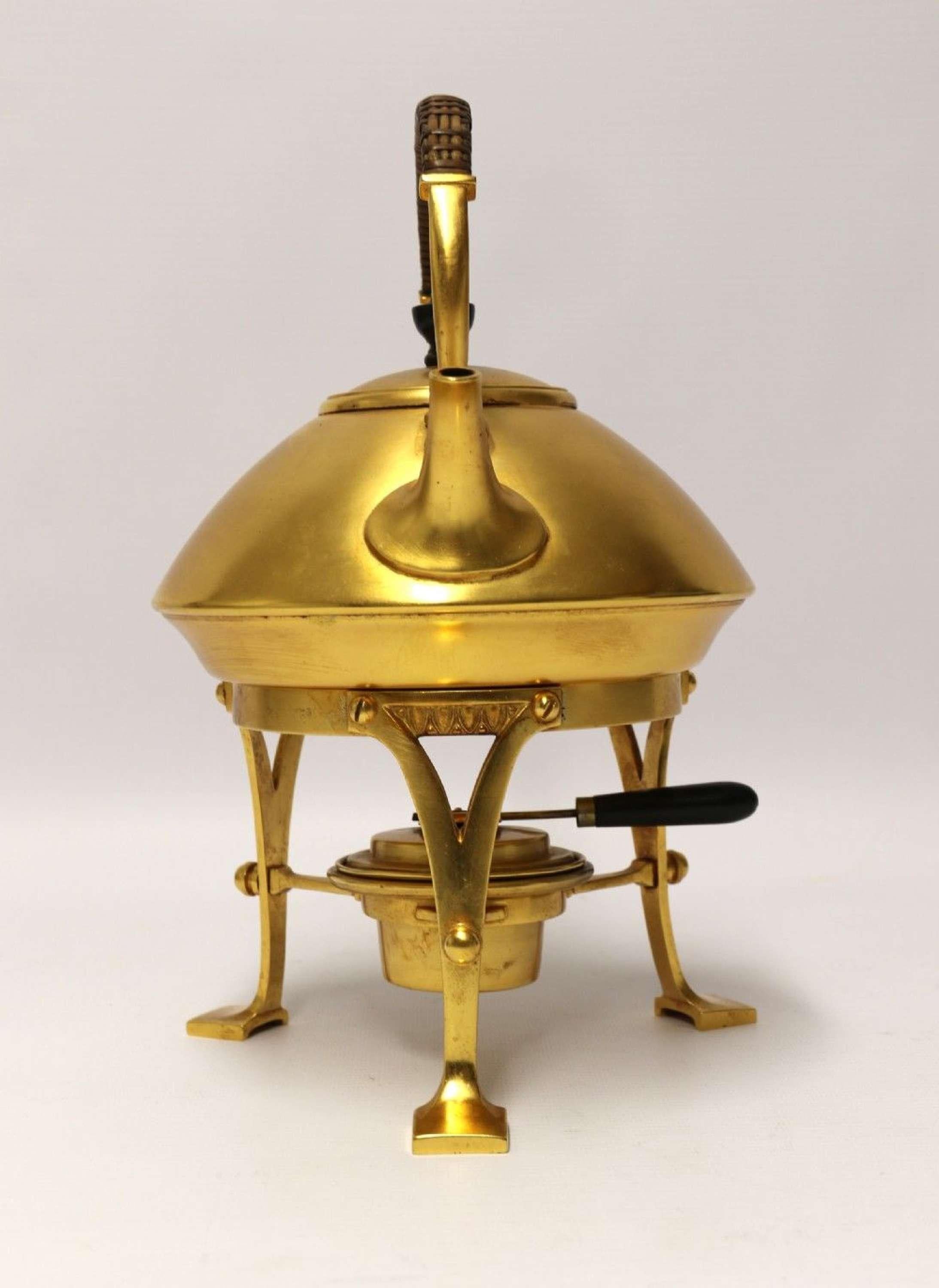 A 19th Century Aesthetic Movement Spirit Kettle

A late 19th century Aesthetic movement Spirit Kettle. This opulent and beautifully made piece is made from brass with gold plated surfaces which is in excellent condition. It is of a wonderful design,
