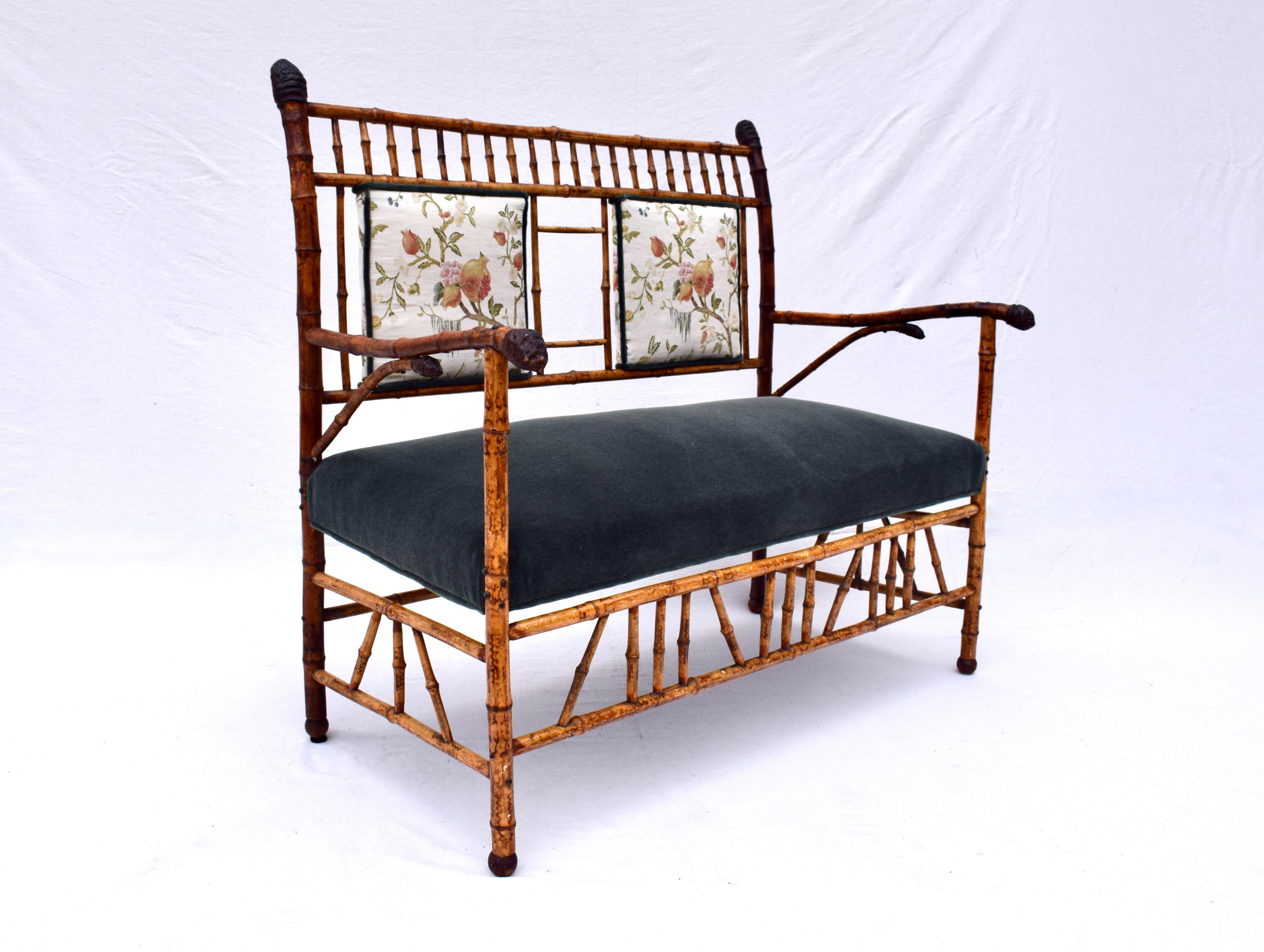 Aesthetic Movement Tortoise bamboo settee carefully curated to emulate Japanned bamboo furniture of the period, in the dark forest green Mohair upholstered seat & Scalamandre embroidered fruits; front and back panels.  Fully restored ready for