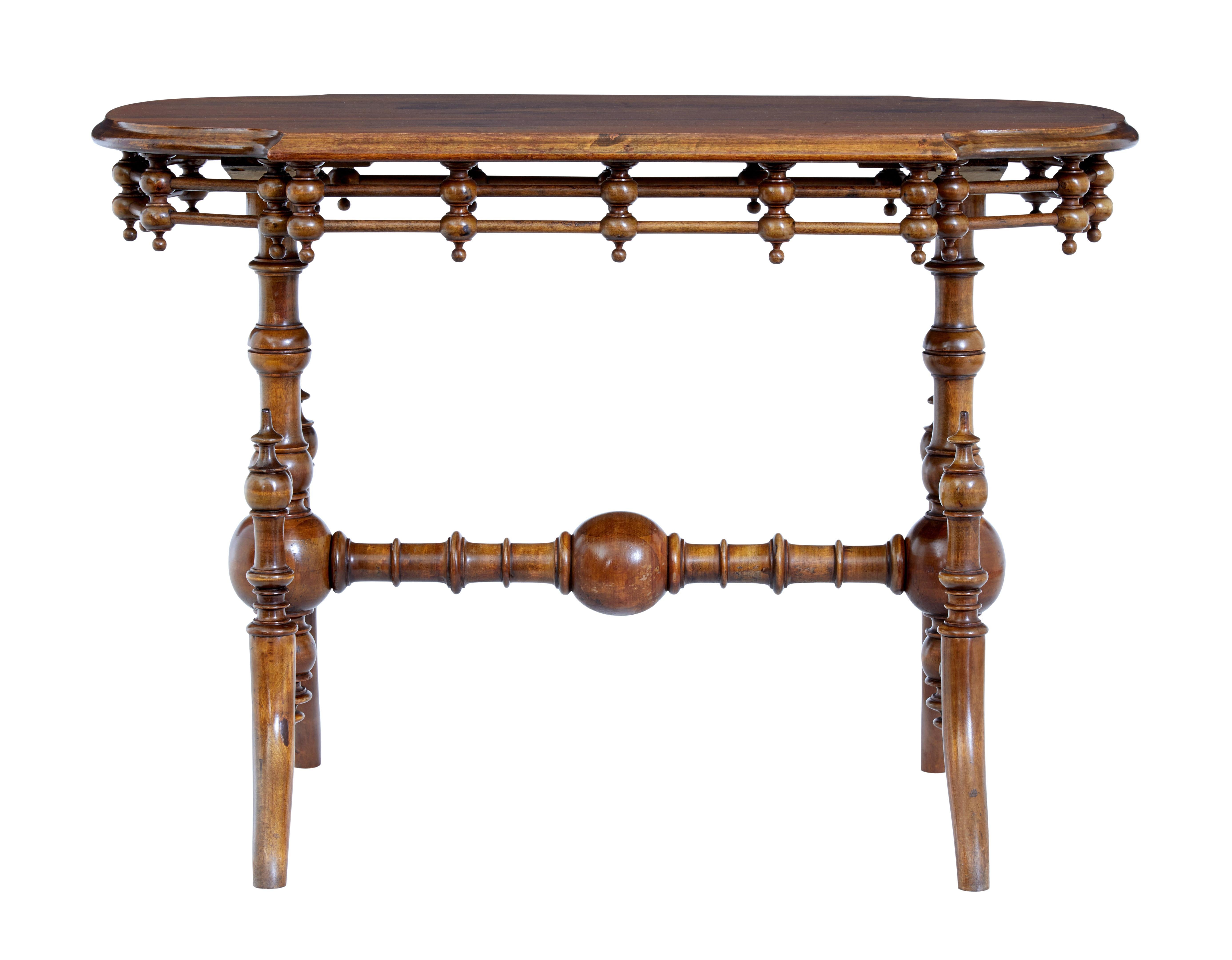19th century aesthetic movement walnut table circa 1890.

Beautiful shaped and turned aesthetic movement inspired side/hall table.

Shaped walnut top with an applied freize of turnings and dowels. Supported by 2 turned bulbous columns and splayed
