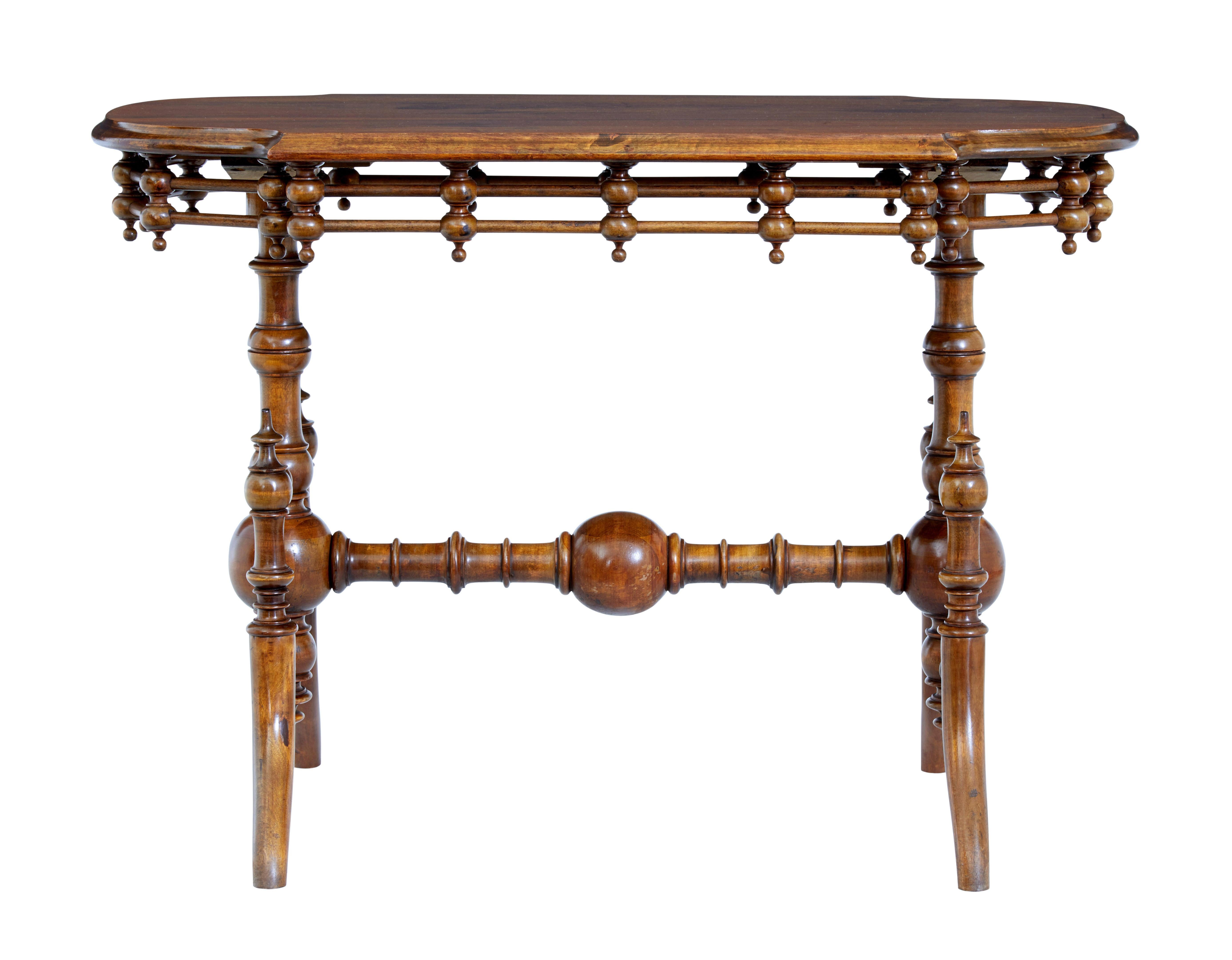 19th century Aesthetic Movement walnut table circa 1890.

Beautiful shaped and turned Aesthetic Movement inspired side/hall table.

Shaped walnut top with an applied frieze of turnings and dowels. Supported by 2 turned bulbous columns and