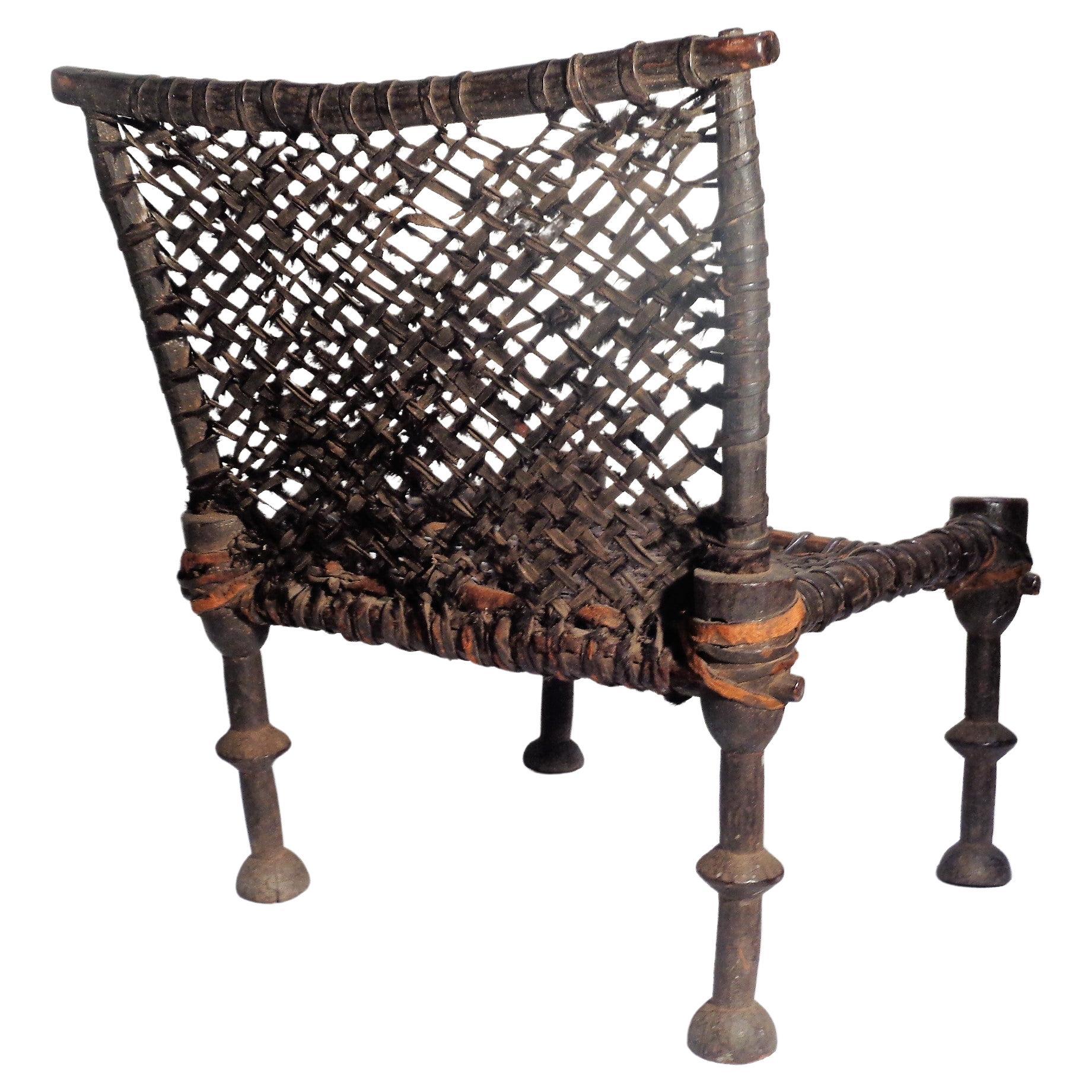 Hand-Carved 19th Century African Wood and Leather Chair For Sale