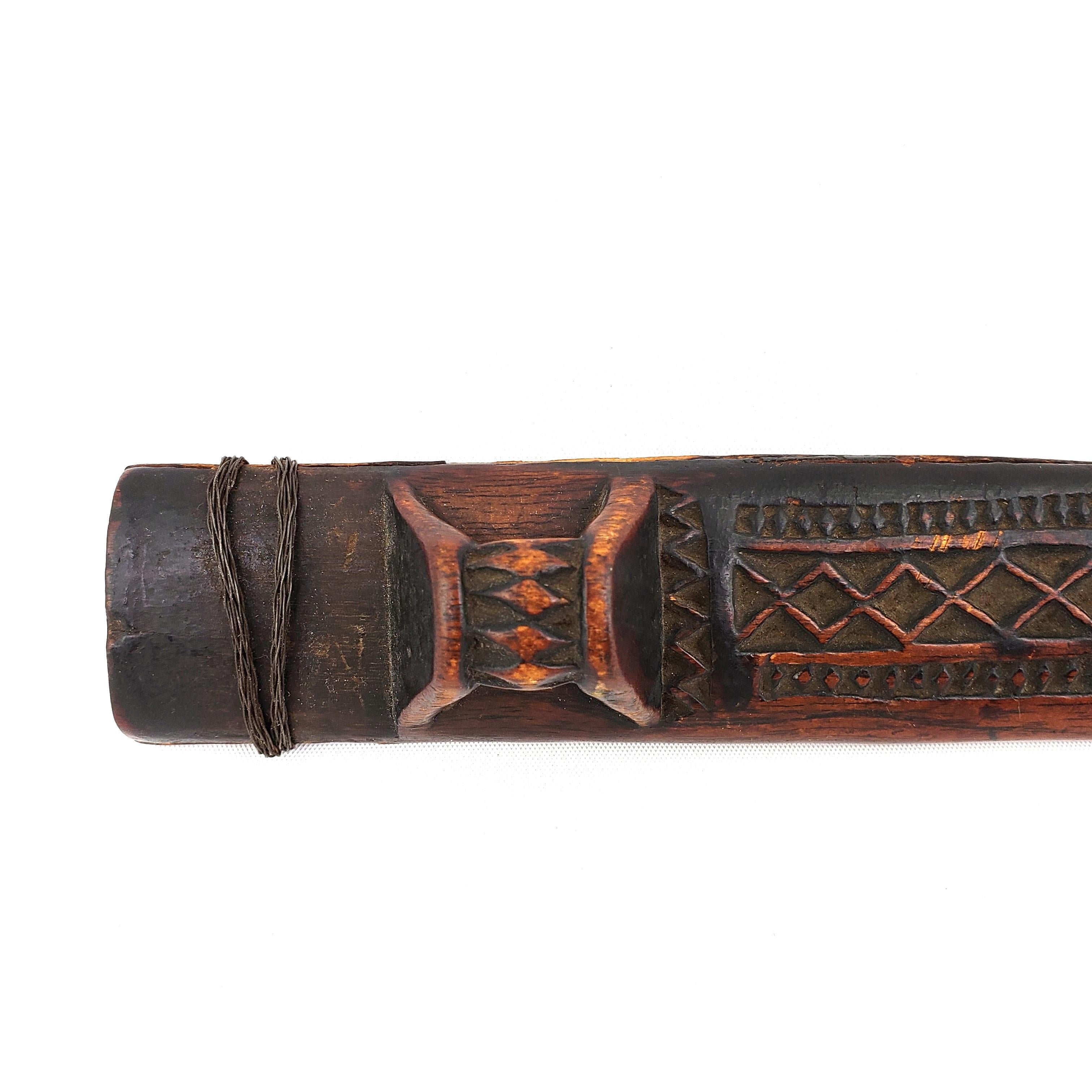 19th Century dagger from the Shona people of Zimbabwe. It features beautiful carvings, a rich aged patina and a handmade steeped blade.