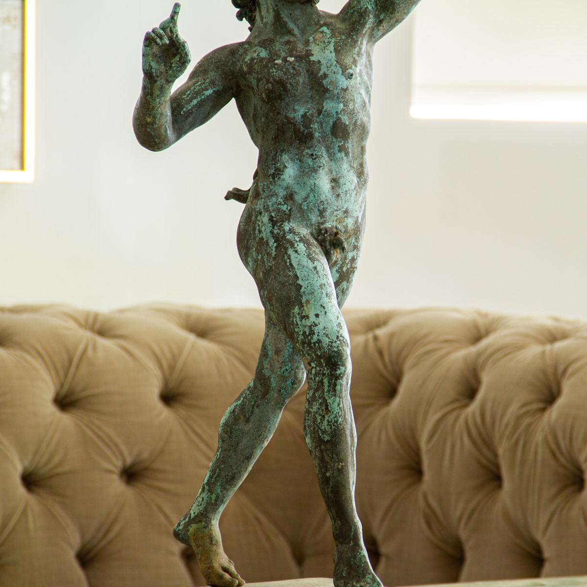 An Italian bronze dancing fawn cast in Naples in the late 19th century. Cast 'After the Antique' and by the foundry 'Chiurazzi Naples'. It also has its tail, fingers and appendages, which are commonly missing or damaged.

The original dancing fawn