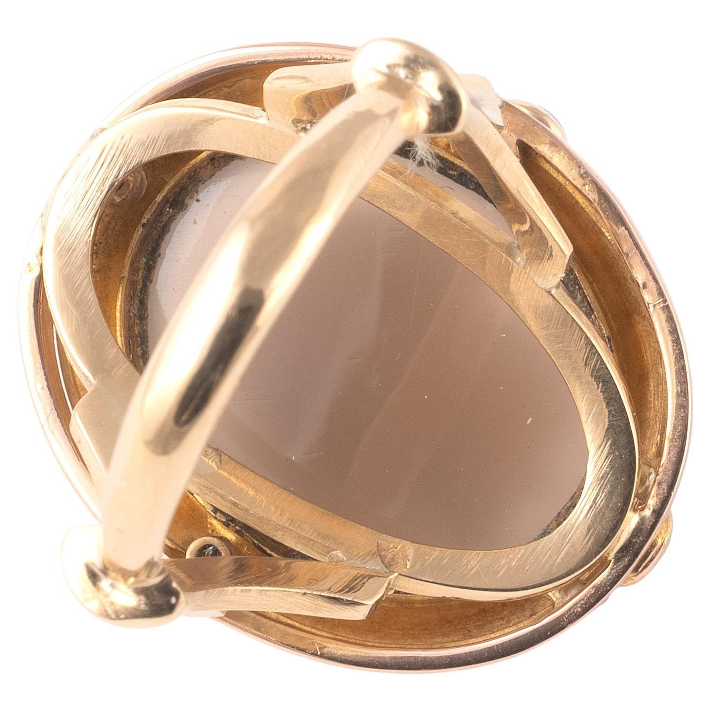 Oval agate cameo depicting the face of the lady with archaeological frame and natural pearls, mounted in 18kt yellow gold
Ring size 7,
Top size is 24mm, width 20mm
Weight: 9.39