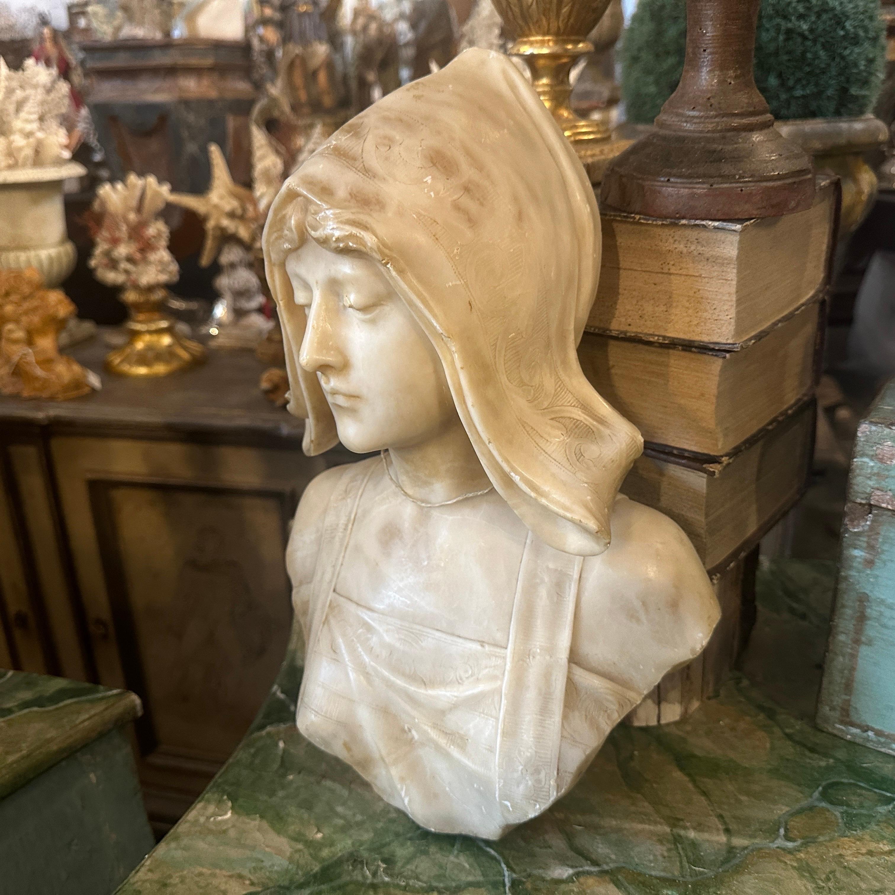 This 19th-century carved alabaster bust of a woman by Massin,