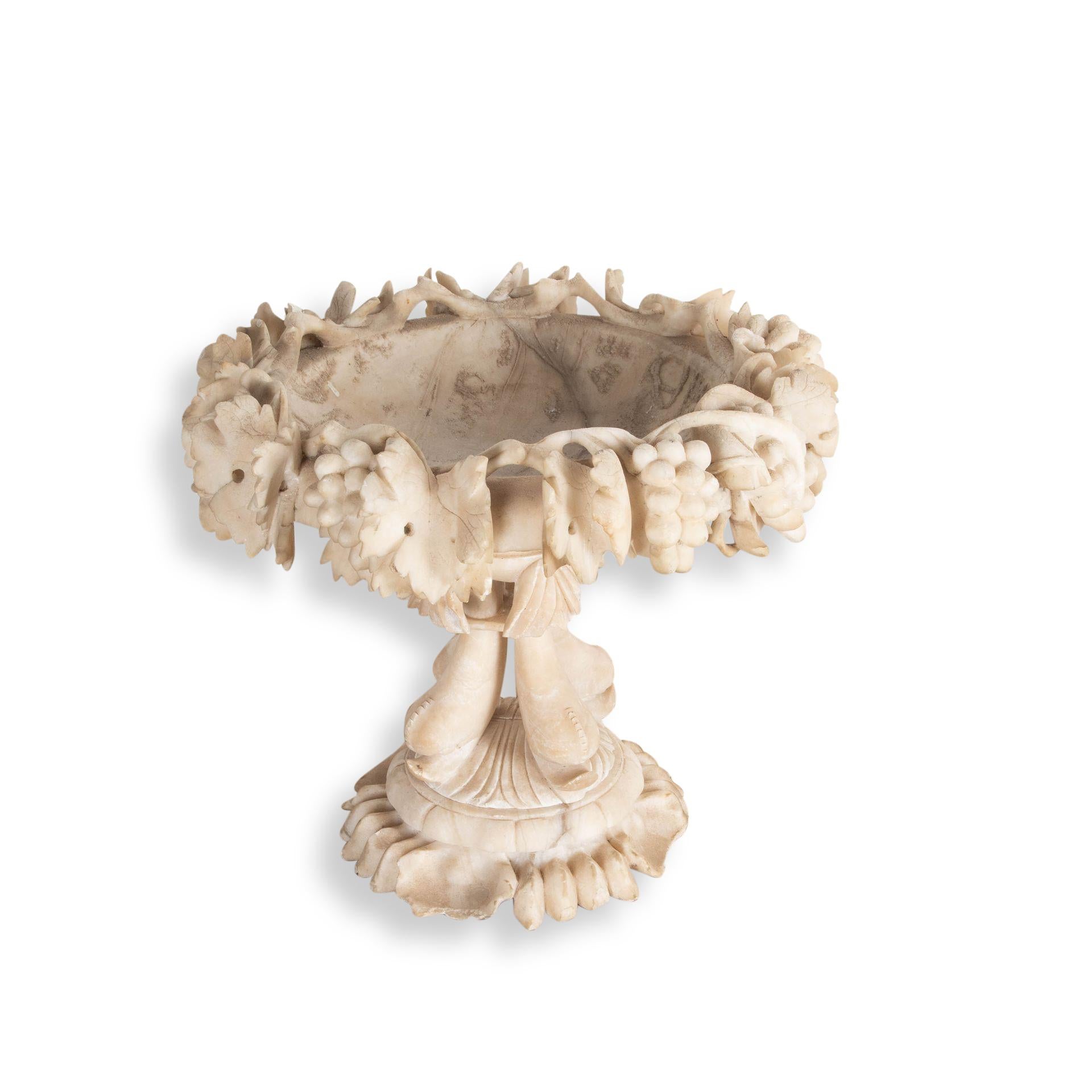 19th century detailed Allabaster Tazza centerpiece. 
Carved fish support a detailed bowl decorated with intricately calved leaves and branches. 