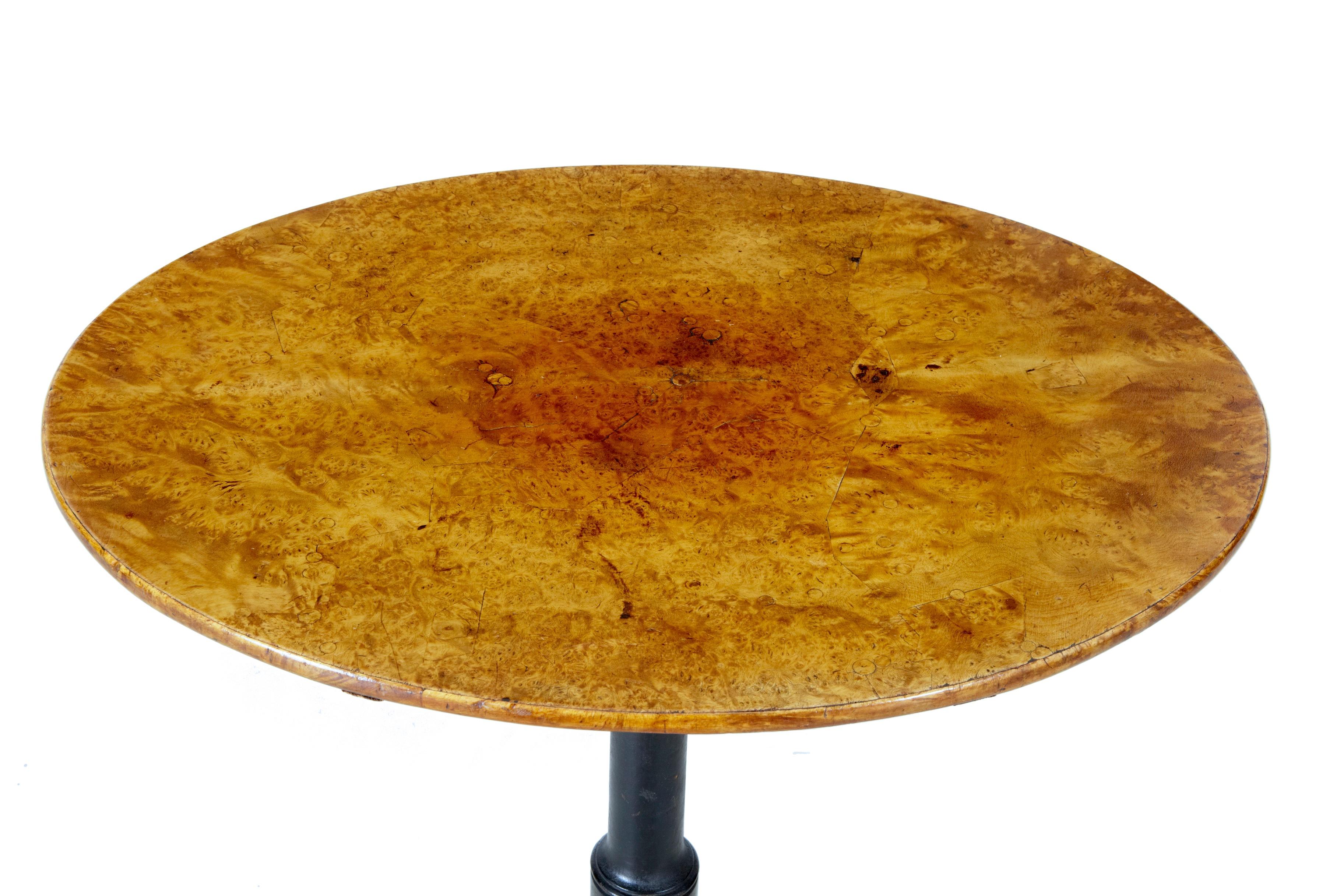 Small oval Swedish wine table, circa 1860.
Fine quality table, with alder root oval top of rare small proportions.
Tilt top, standing on ebonized tripod base, terminating on pad foot.
 