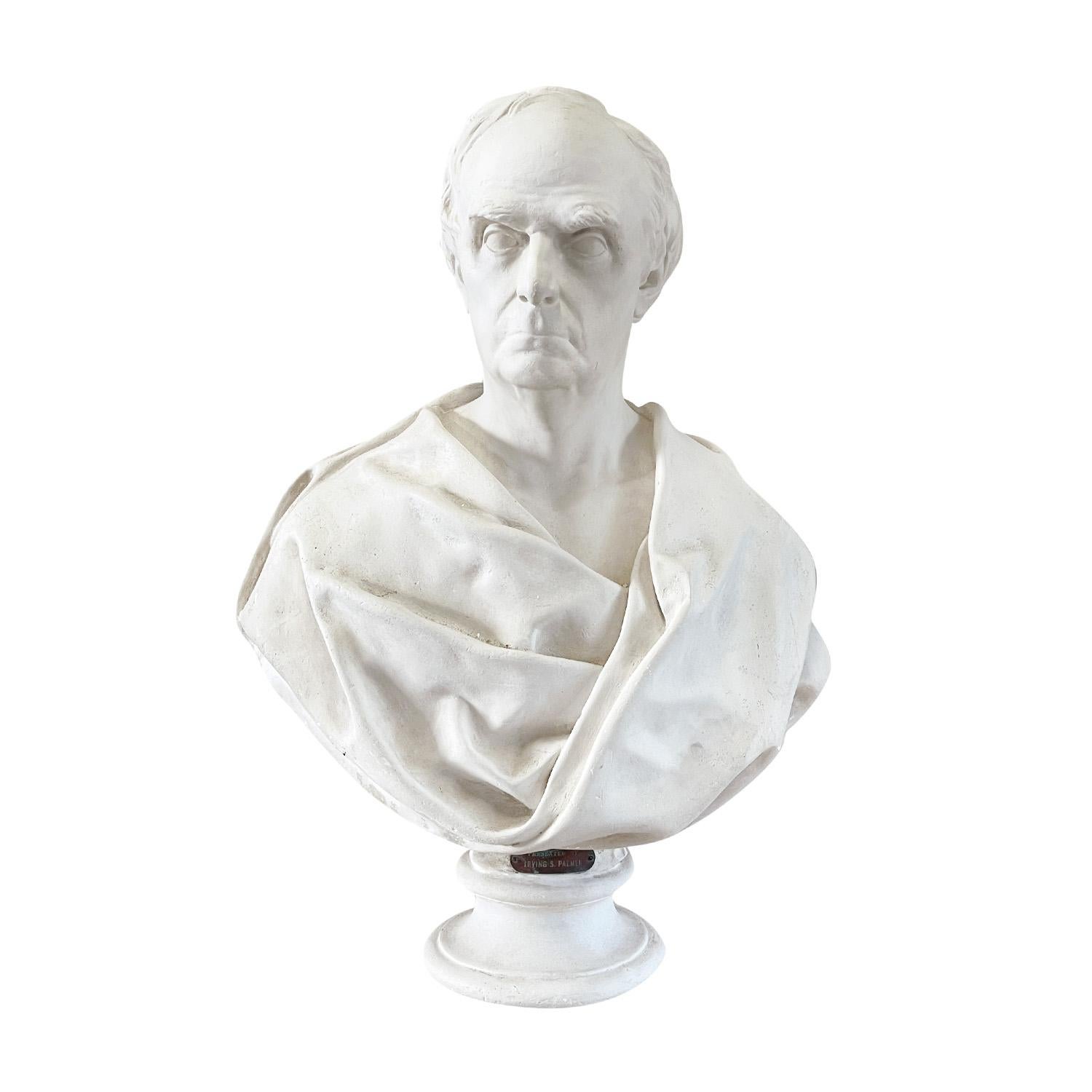 An antique American bust of Secretary of State Daniel Webster made of hand crafted French plaster, executed by Irving S. Palmer in good condition. The detailed sculpture stands on a circular foot. Labeled with a metal sign at the front base -