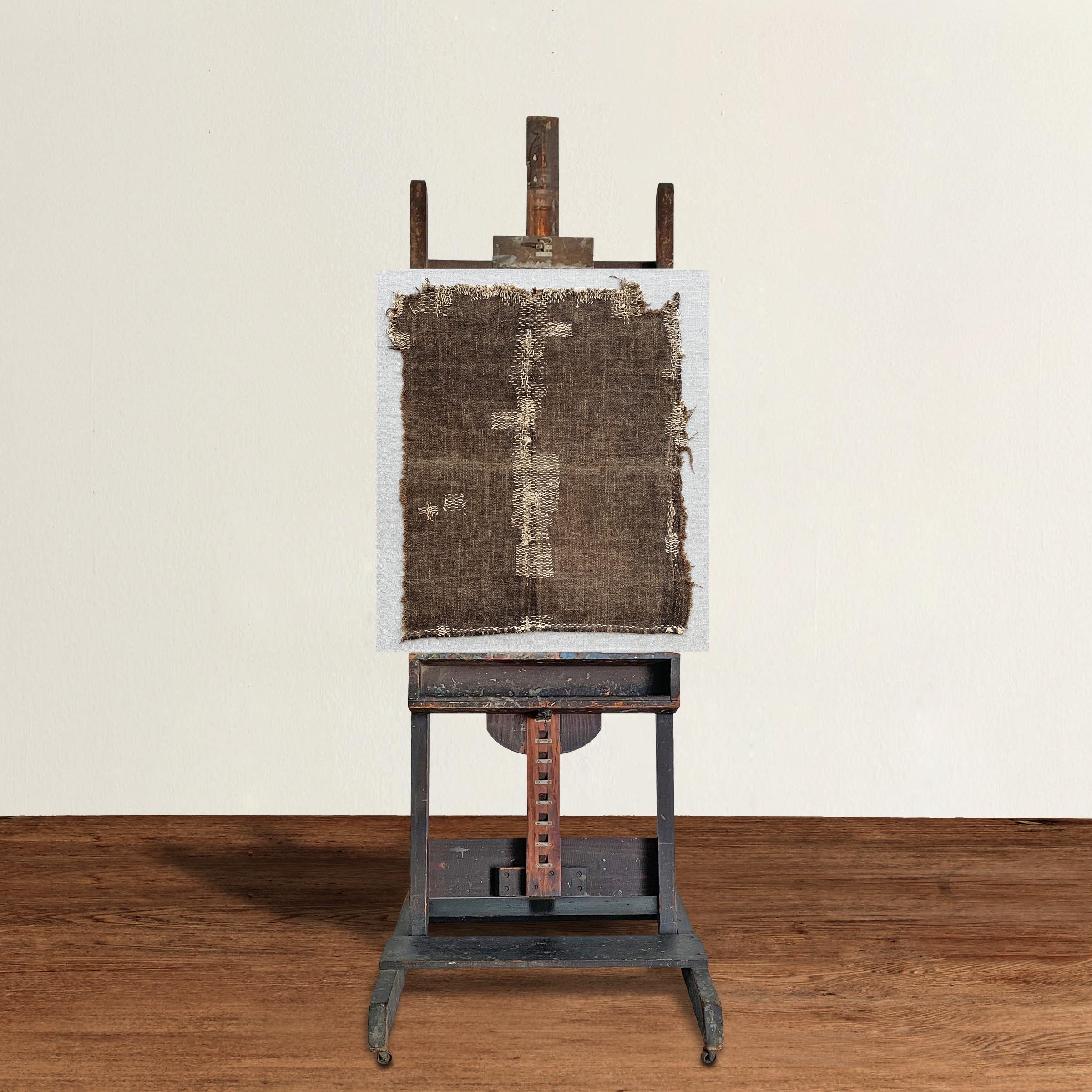 A wonderfully charming 19th century American wooden artist's easel, adjustable in pitch and height, and covered in over a hundred years of paint drips. Perfectly functional, but also excellent for displaying your favorite painting or for mounting