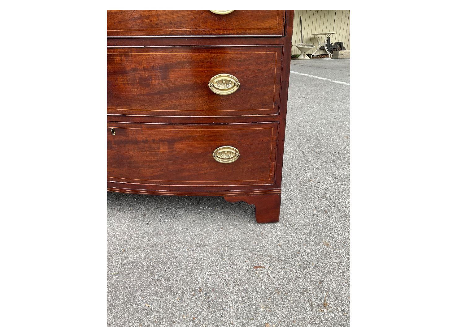 This is a beautiful American bow front chest with a string inlay and beautiful character in the wood. It’s recently been polished which helps show the amazing patina. All drawers are in excellent condition and slide perfectly. 