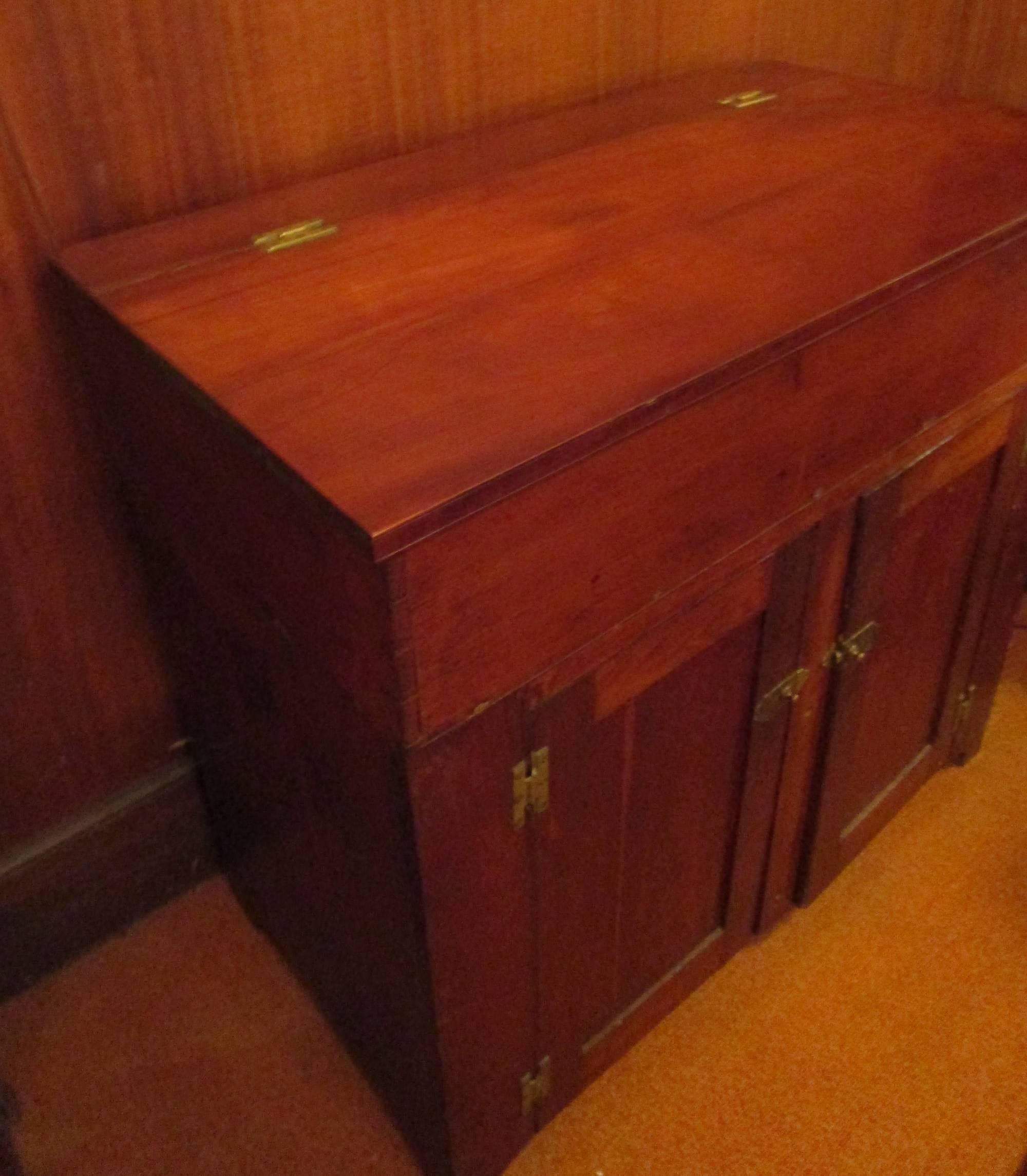 Primitive American cherrywood dry sink. Retains the original brass latches and 