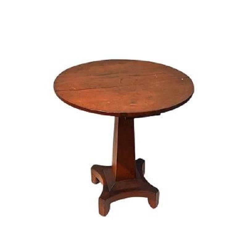 19th century country center table, in the classical style, retaining its original red wash and having a 30