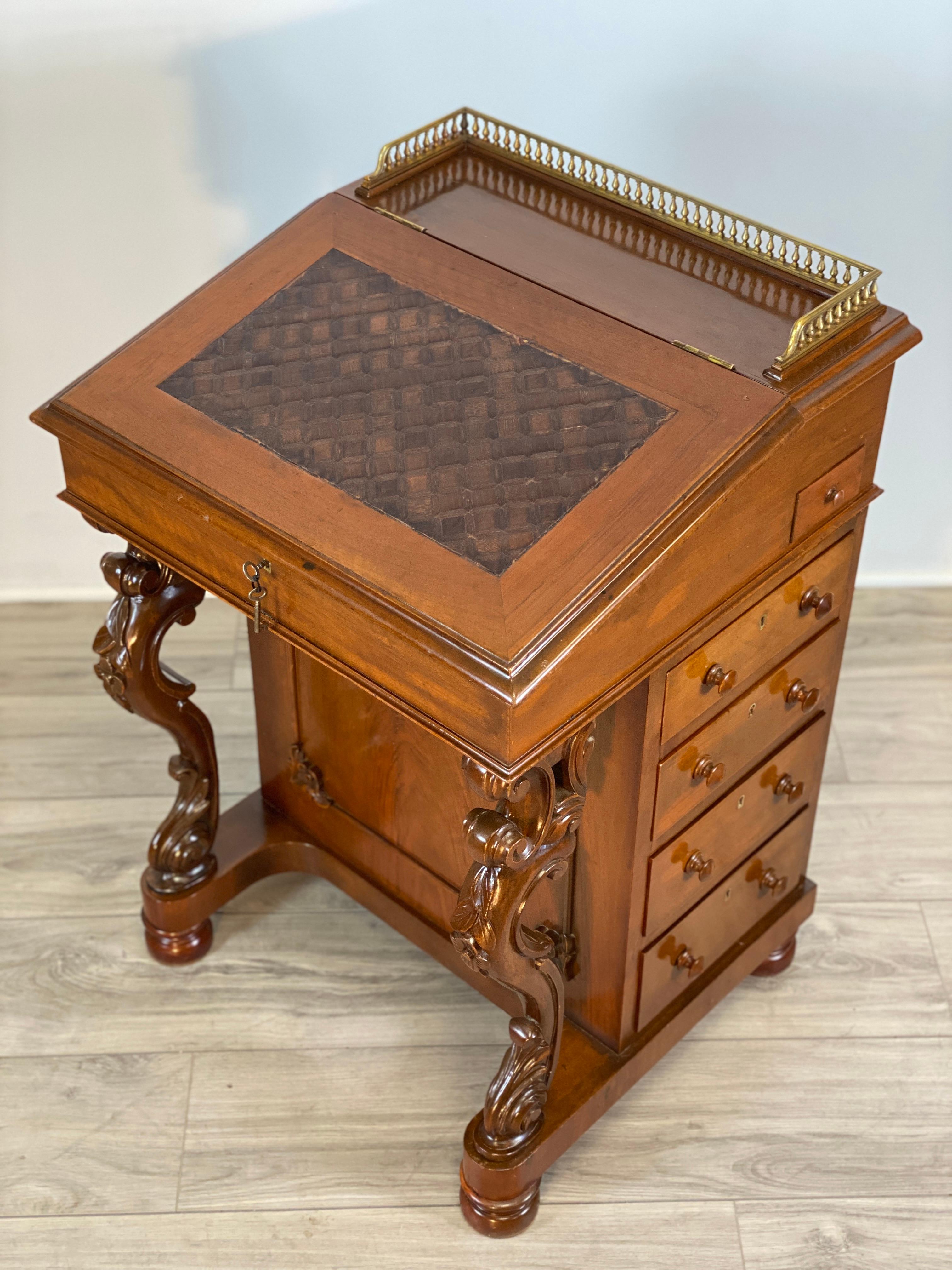 This is a well-built, hand-crafted Mahogany Davenport desk/ lecture stand. The slanted writing surface is fitted with wooden parquetry inlay pattern. The top rear is fitted with a brass gallery. The writing surface open to reveal a maple lined