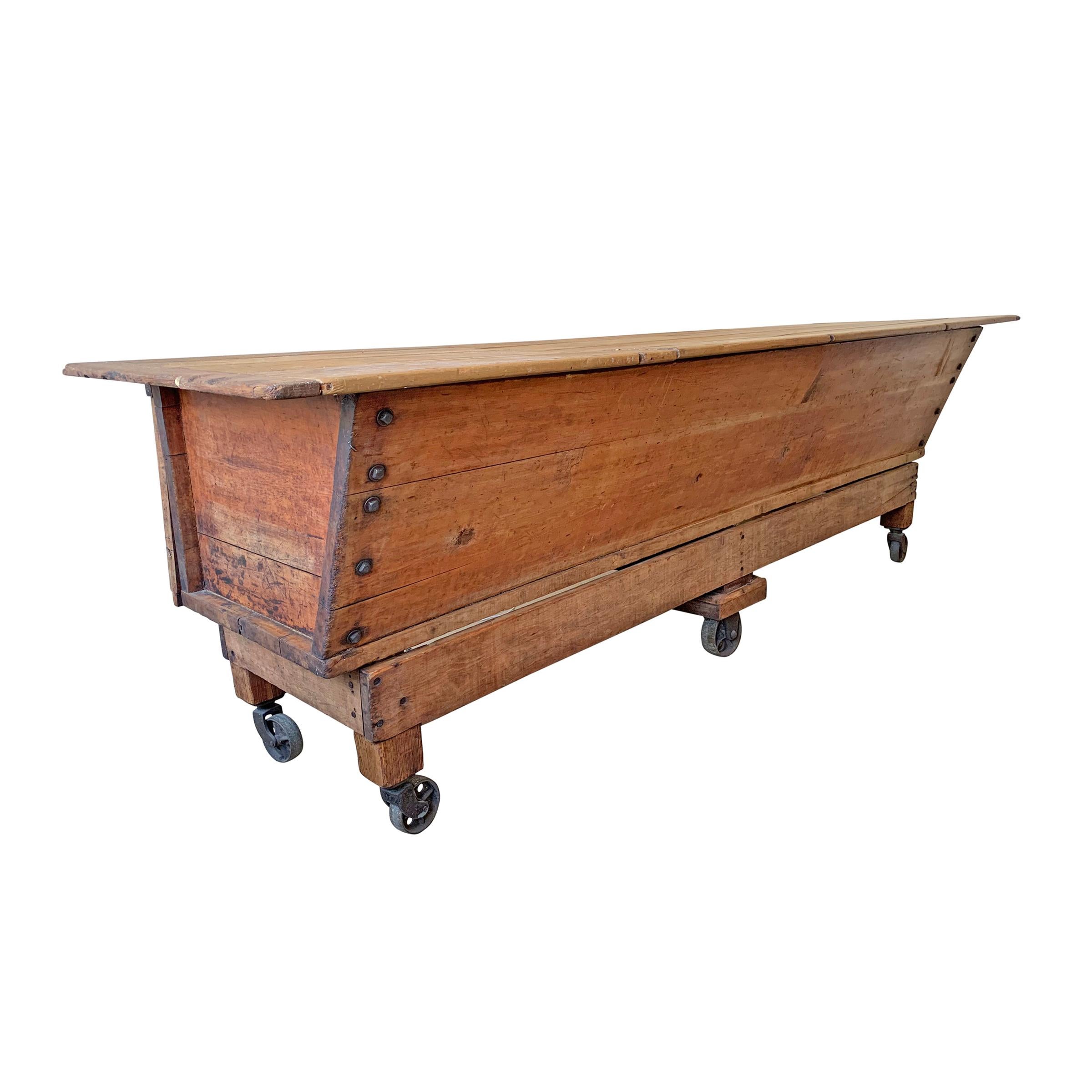 An incredible late 19th century American dough table from a commercial bakery with a two-part removable top and a chamber that was originally used to proof balls of dough. This is the ultimate console table, sideboard, shop counter, kitchen island,