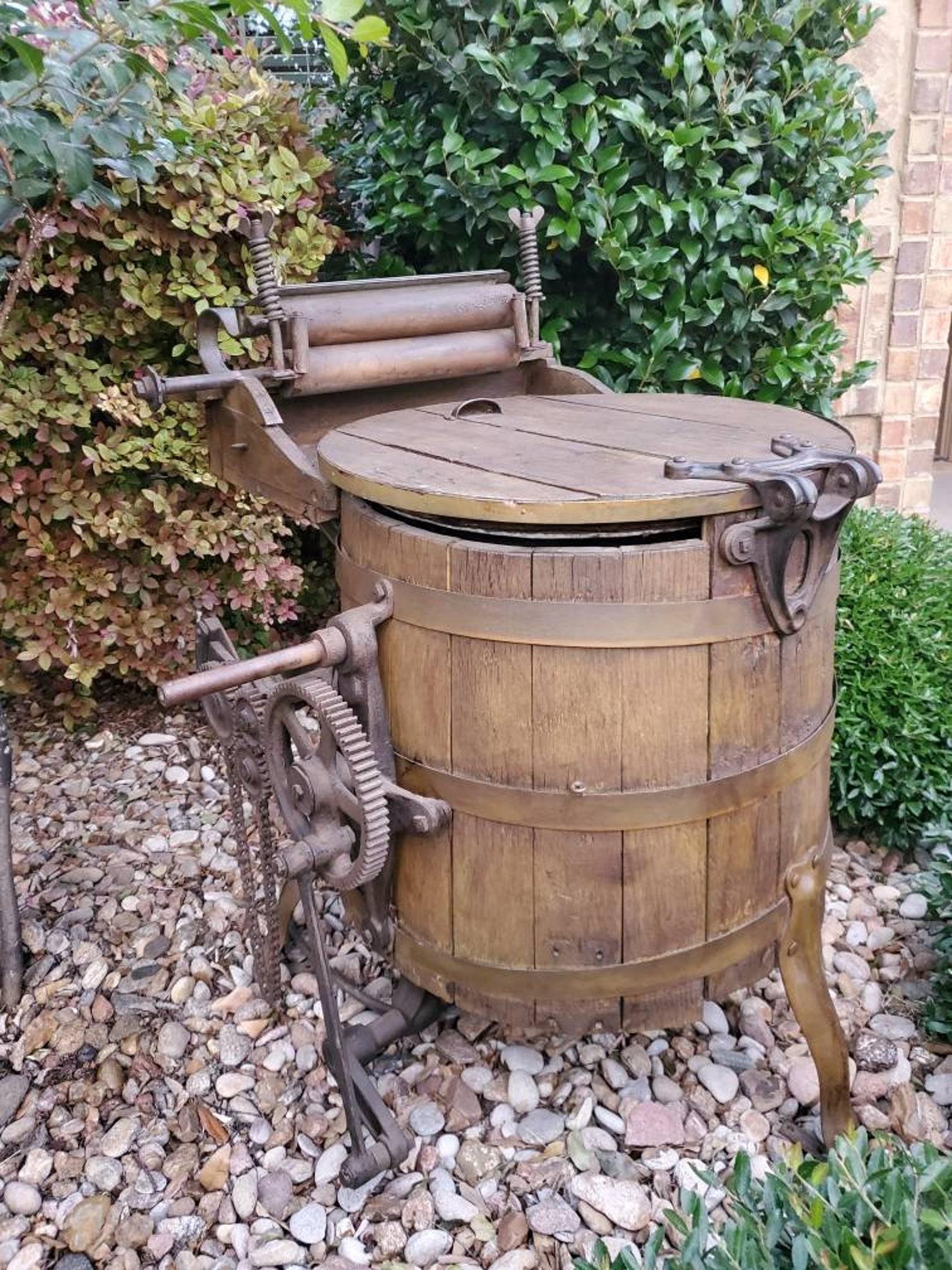 Impress all your neighbors with this magnificent piece of yard art! Or add an original rustic industrial element to your modern farm house!

A rare, hard to find, rustic antique (believed to be American) hand powered early clothes washing machine.