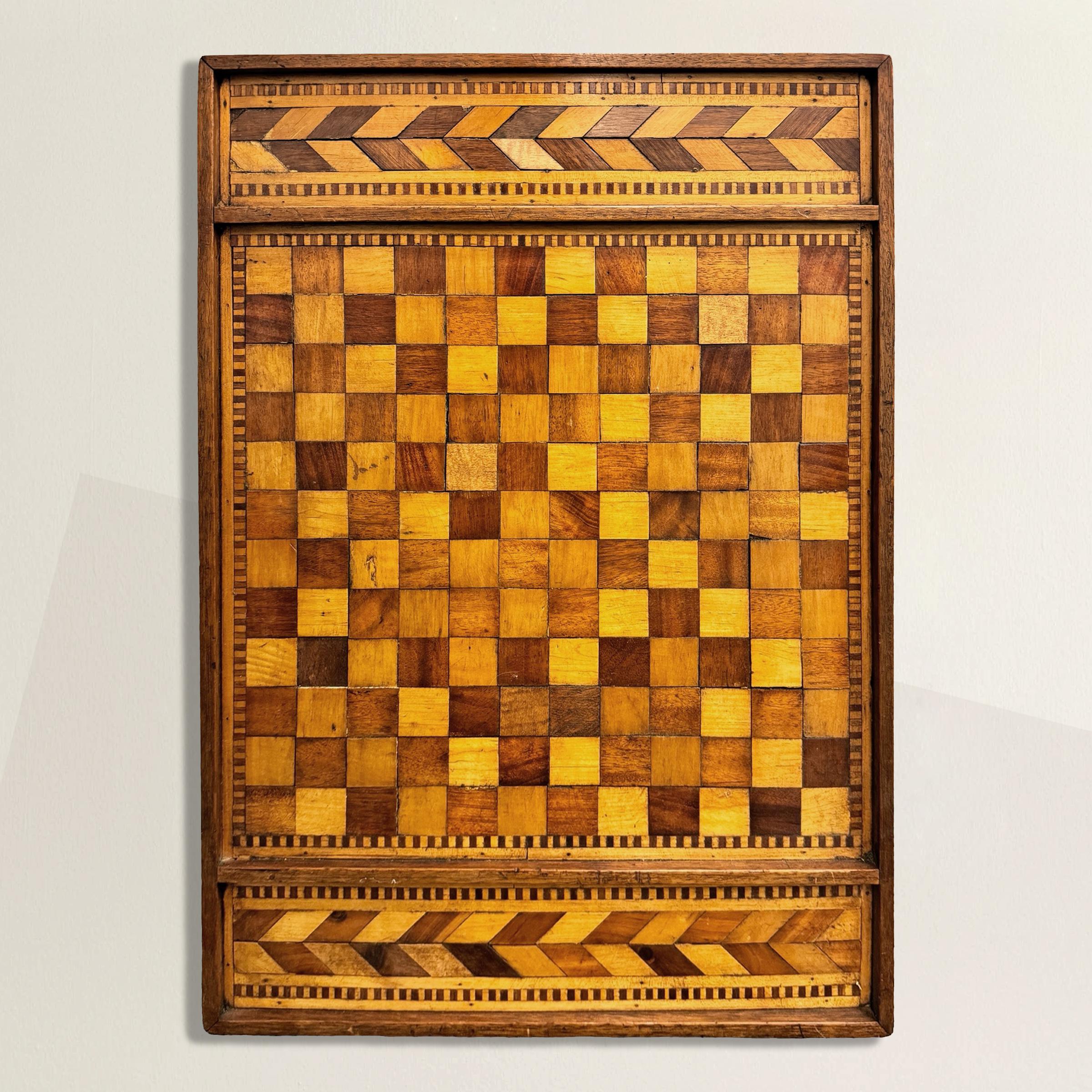 This 19th-century American folk art game board is a quintessential example of the ingenuity and aesthetic appeal found in traditional American crafts. Composed of alternating walnut and maple squares in a 12 by 12 pattern, this board showcases the