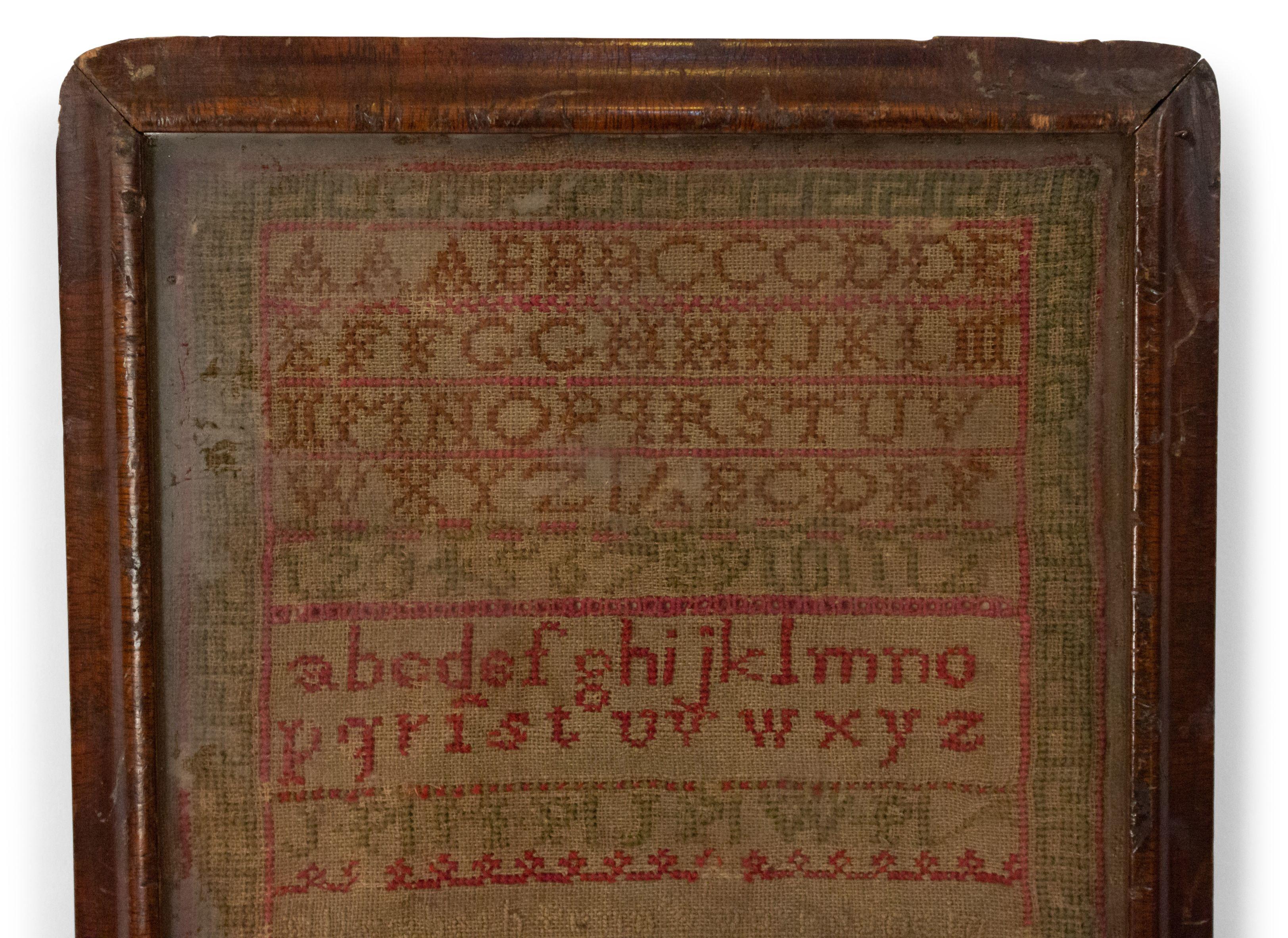 American Country kleines gesticktes Mustertuch mit grünem und rotem Alphabet in gebeiztem Holzrahmen (signiert ELIZ. PENN,1820).
 