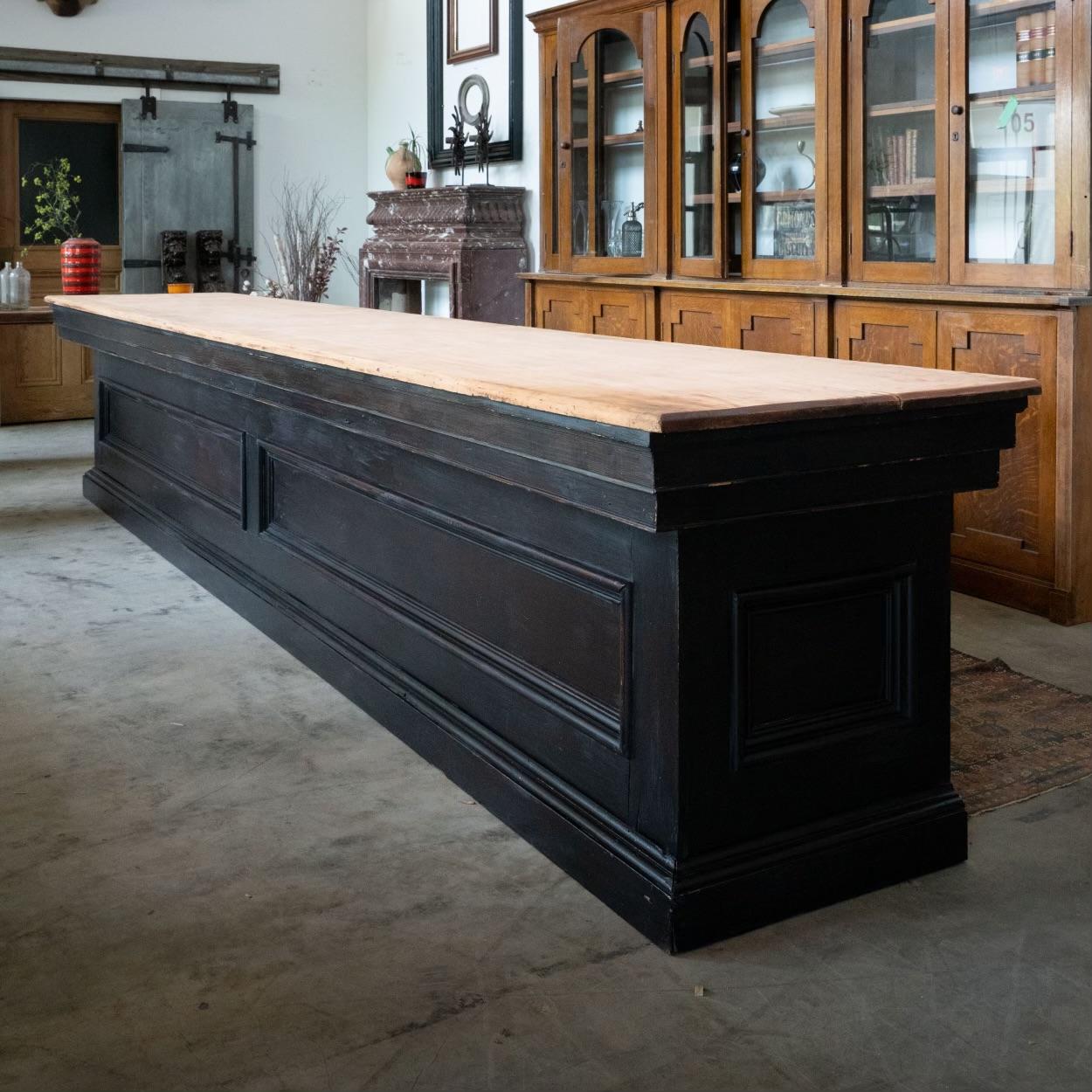 We have a pair of 16 ft General Store Working counters with panelled fronts and sides , original wood tops, square nailed construction, open backs with a floor.

Found in Nebraska. These are fine examples of survivors in old finish solid working