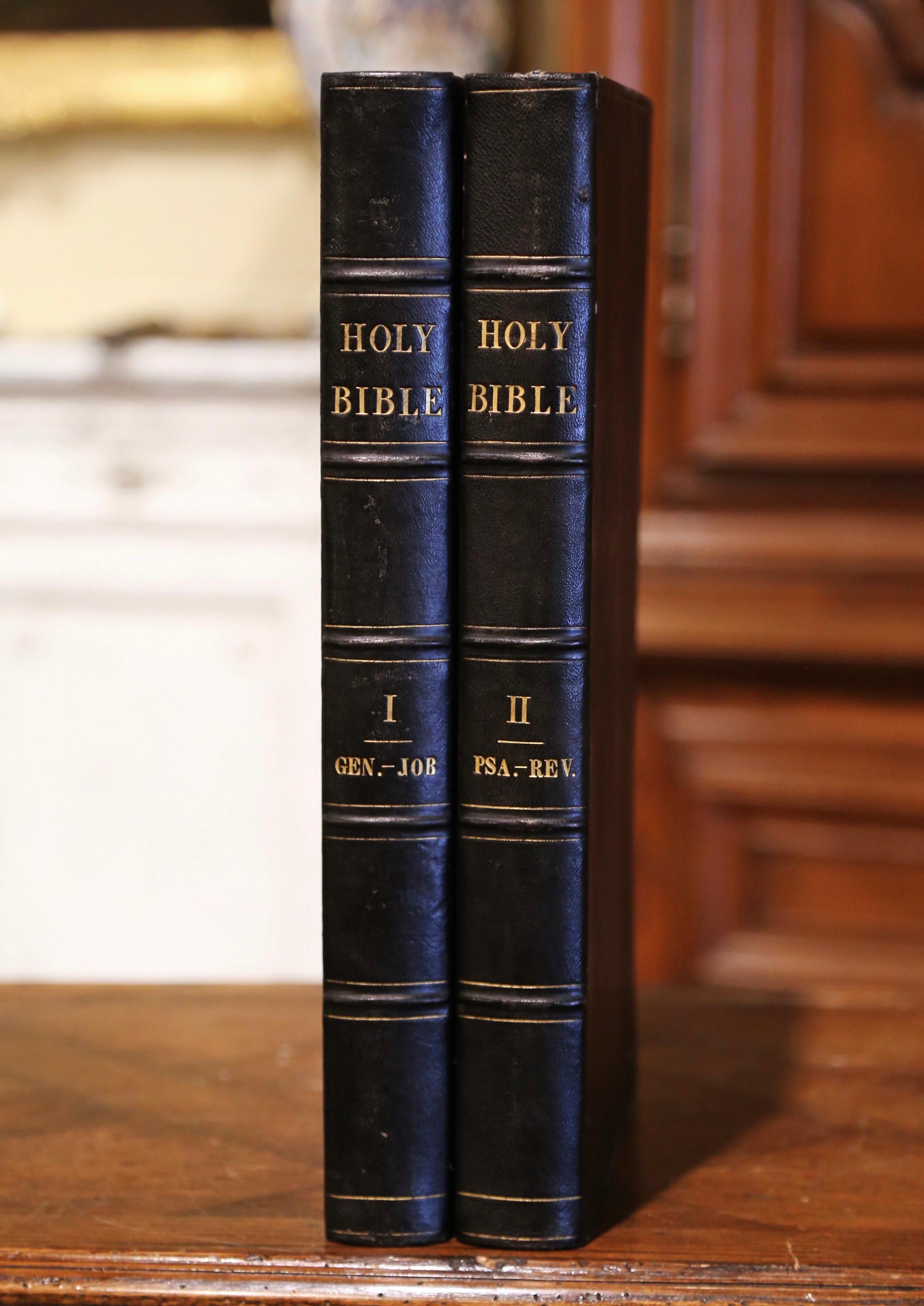 Listen to the word of God with these two-volume antique family Bibles. Published by Joseph Teal and printed in Boston in 1822 each holy book is dressed with black leather and gilt, gold leaf page edges, and colorful inside parchment. Both books are