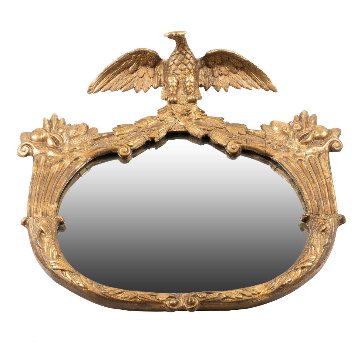 Cadre de miroir ovale en gesso doré avec crête d'aigle flanquée de cornes d'abondance.
Américain, New York, vers le XIXe siècle.