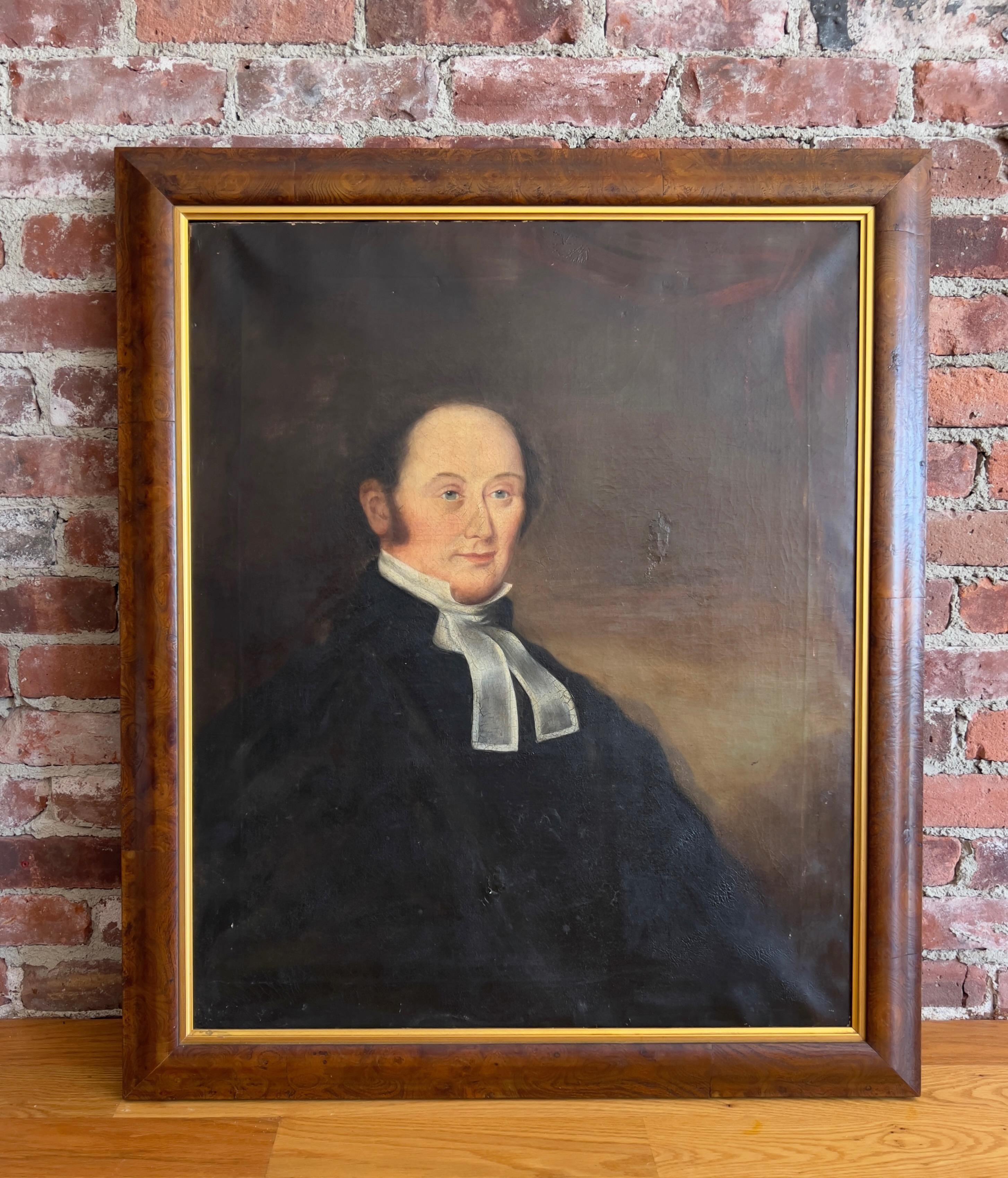 A striking 19th-century American School oil on canvas portrait of a clergyman, painted in rich, moody tones. The sitter, dressed in formal black robes with white preaching tabs, is depicted with a calm and thoughtful expression—a hallmark of early