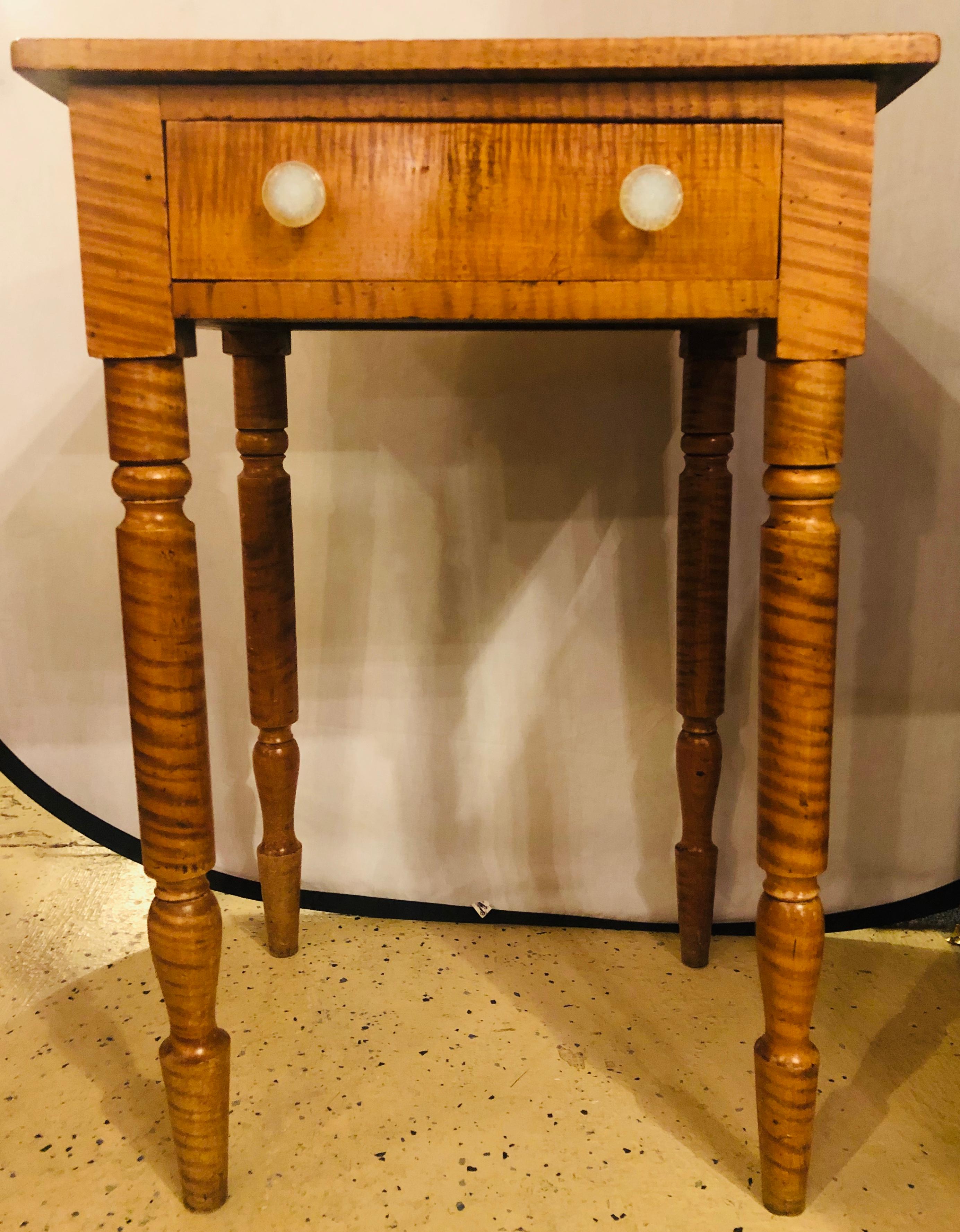19th century American Sheraton cherry and tiger maple stand with one-drawer and milk glass pulls. Finished on all sides.

  