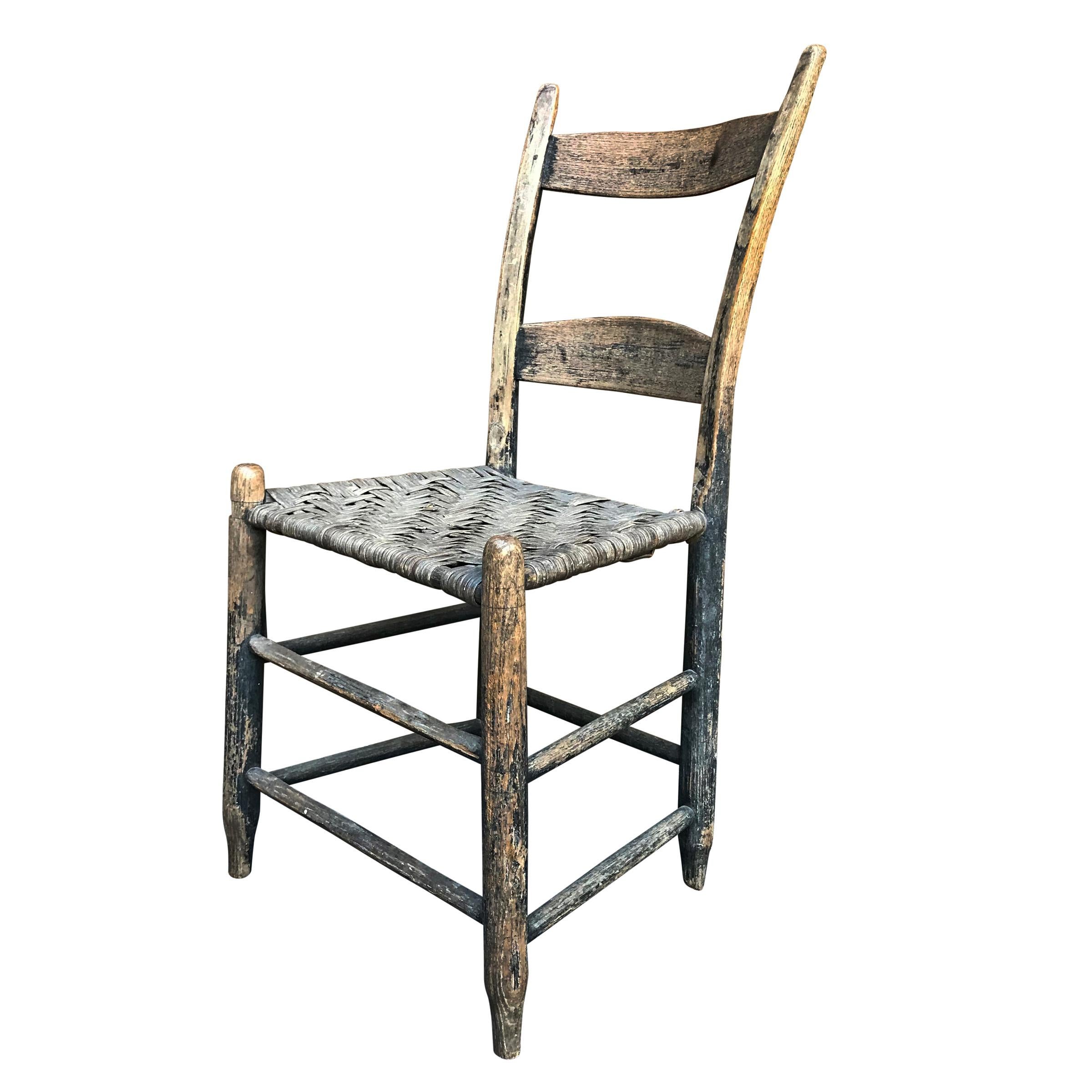 A wonderful 19th century American side chair with complex bent and curved back stiles, a woven splint seat, and the most perfect patina. The seat is very strong.