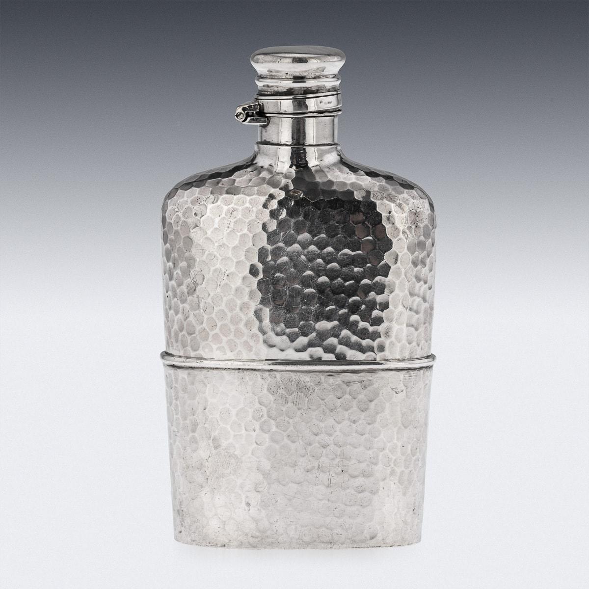 Antique 19th Century American solid silver hip flask with silver hinged top and removable cup. This flask has an outer design of a hammered pattern. Hallmarked sterling silver (925 standard), circa 1880, Makers mark for Gorham, Rhode