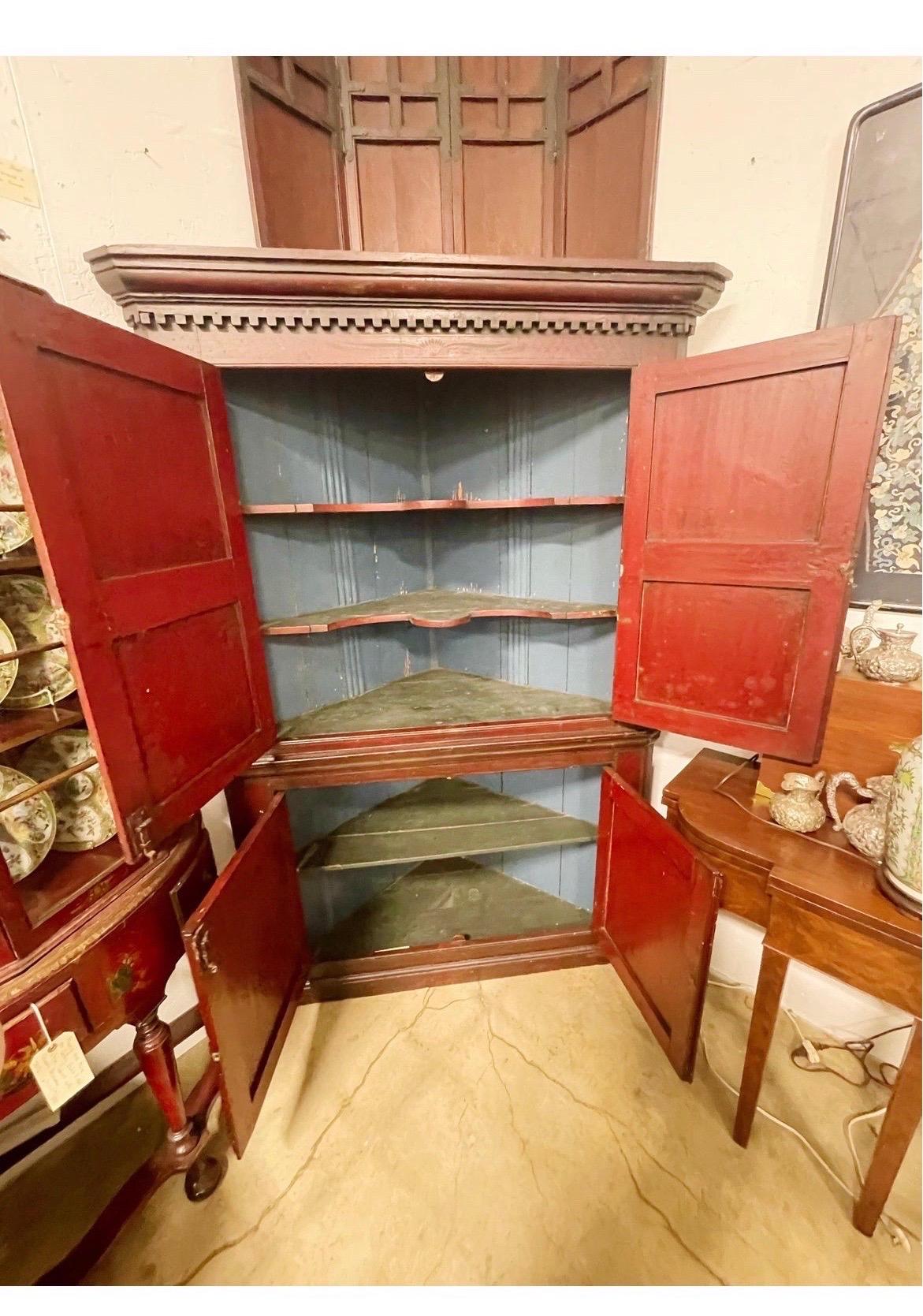 A very impressive 19th century corner cabinet. Likely American and southern state in origin - was purchased from an estate in Atlanta GA. According to the family, their great grandparents purchased the home with the cabinet. It has fine dark red