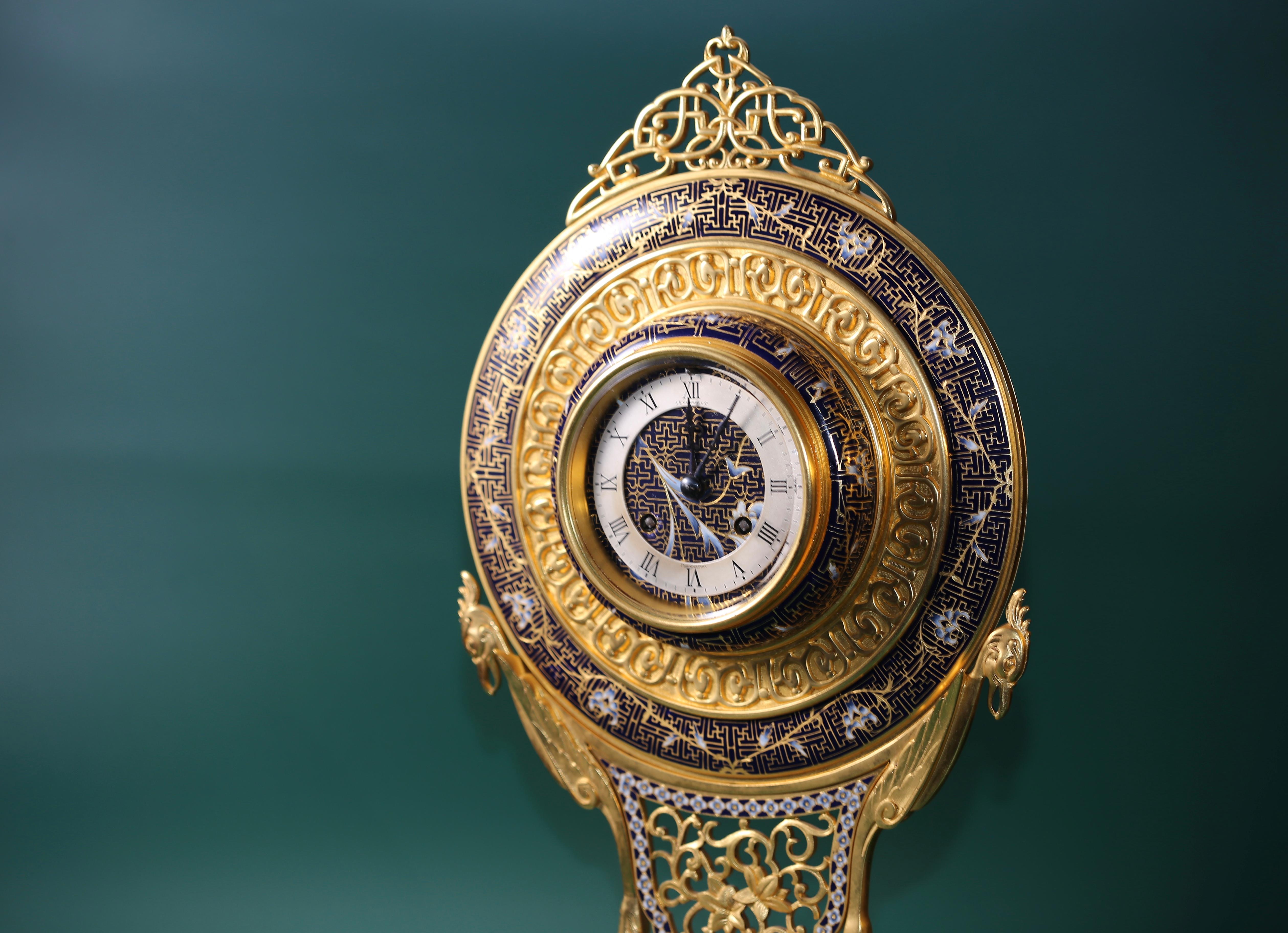 A very fine 19th century American standing clock by J.E Caldwell & Co, made in Philadelphia, USA. This item is of very high artistic merit due to its gilt bronze finishes with Enamel, very rarely combined with oriental buddhism design elements.