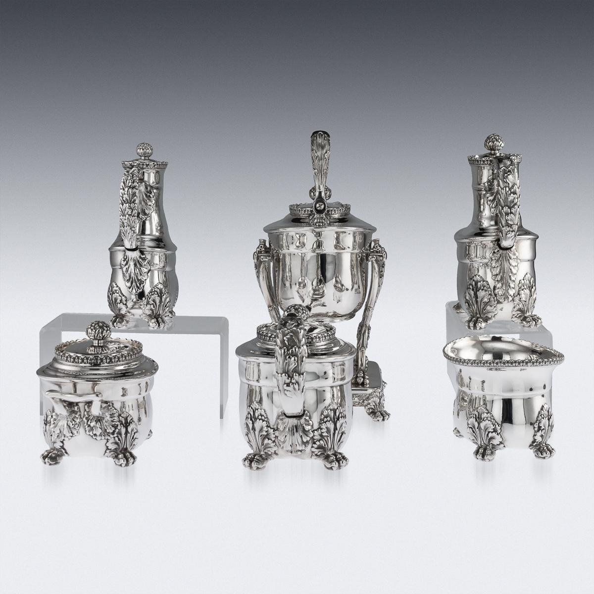 Antique 19th century American rare and magnificent six piece tea service, comprising a kettle, coffee pot, teapot, covered sugar bowl, waist bowl, covered cream jug, each piece on four lion paw feet, plain can shaped body applied with large acanthus