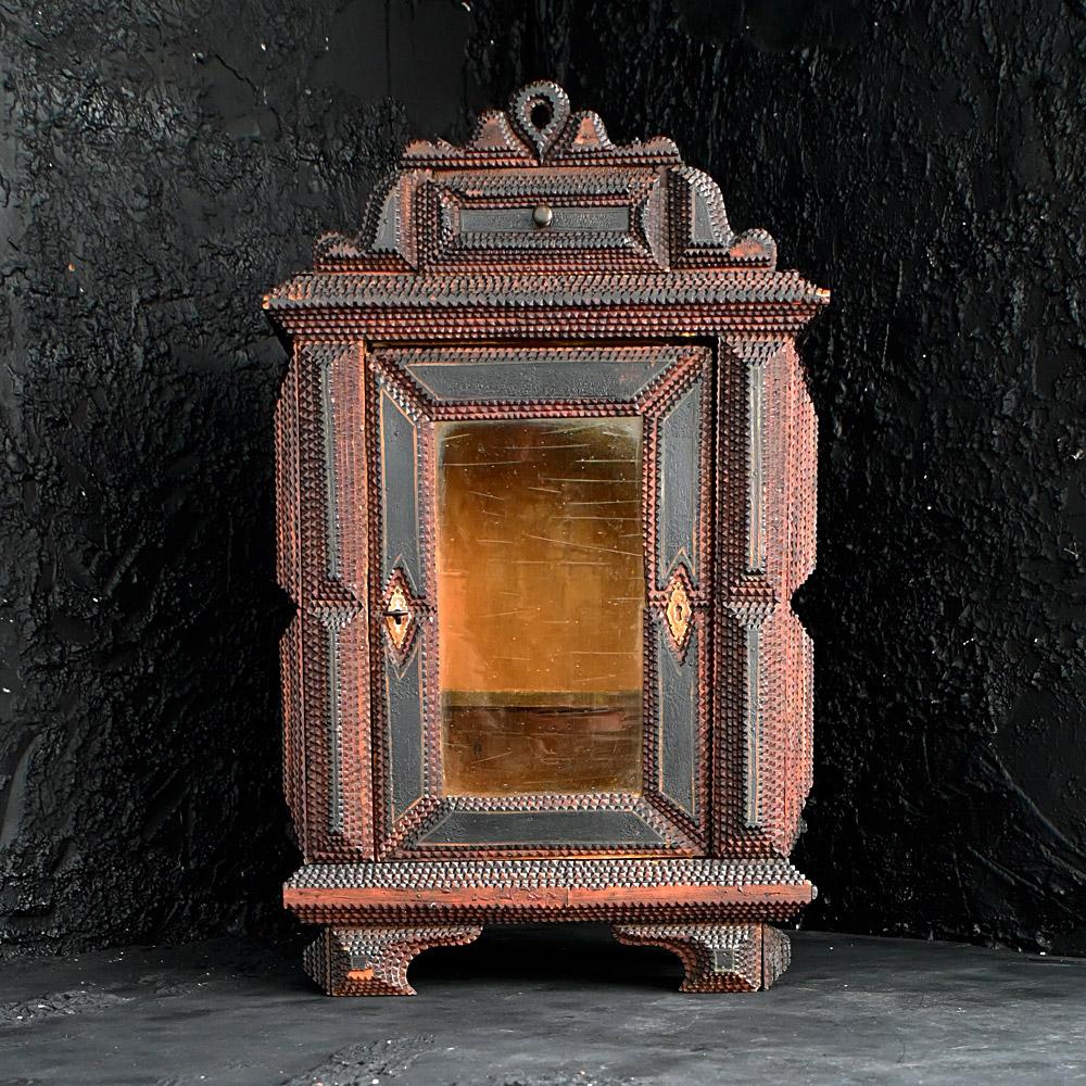 19th Century American Tramp Art Cabinet 
An authentic example of a late 19th Century hand crafted American tramp art cabinet. Untouched in form, still with its original glass window which is firmly in place. With a single shelf section inside and