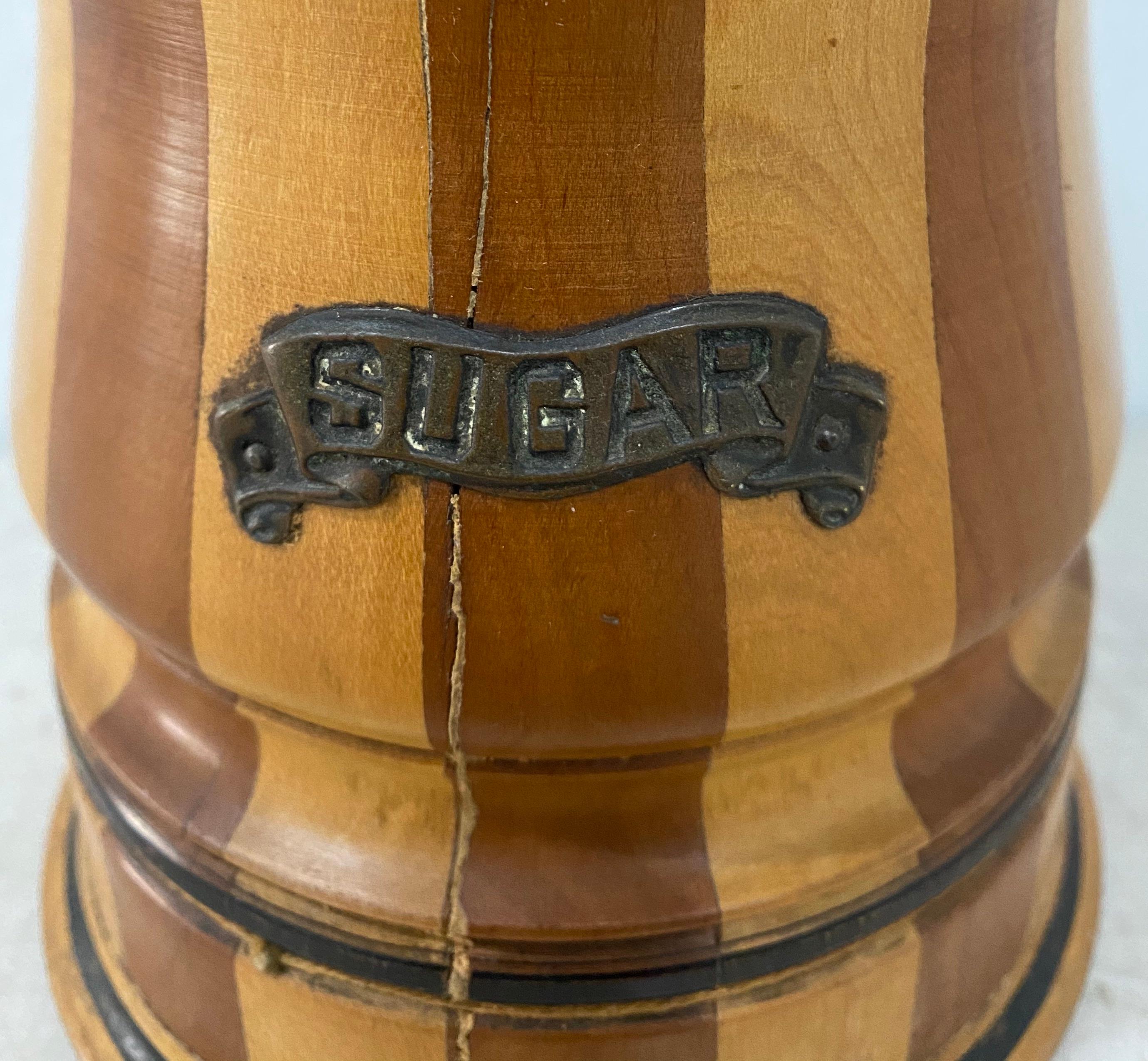 19th century American treenware sugar canister with lid

Dimensions: 5