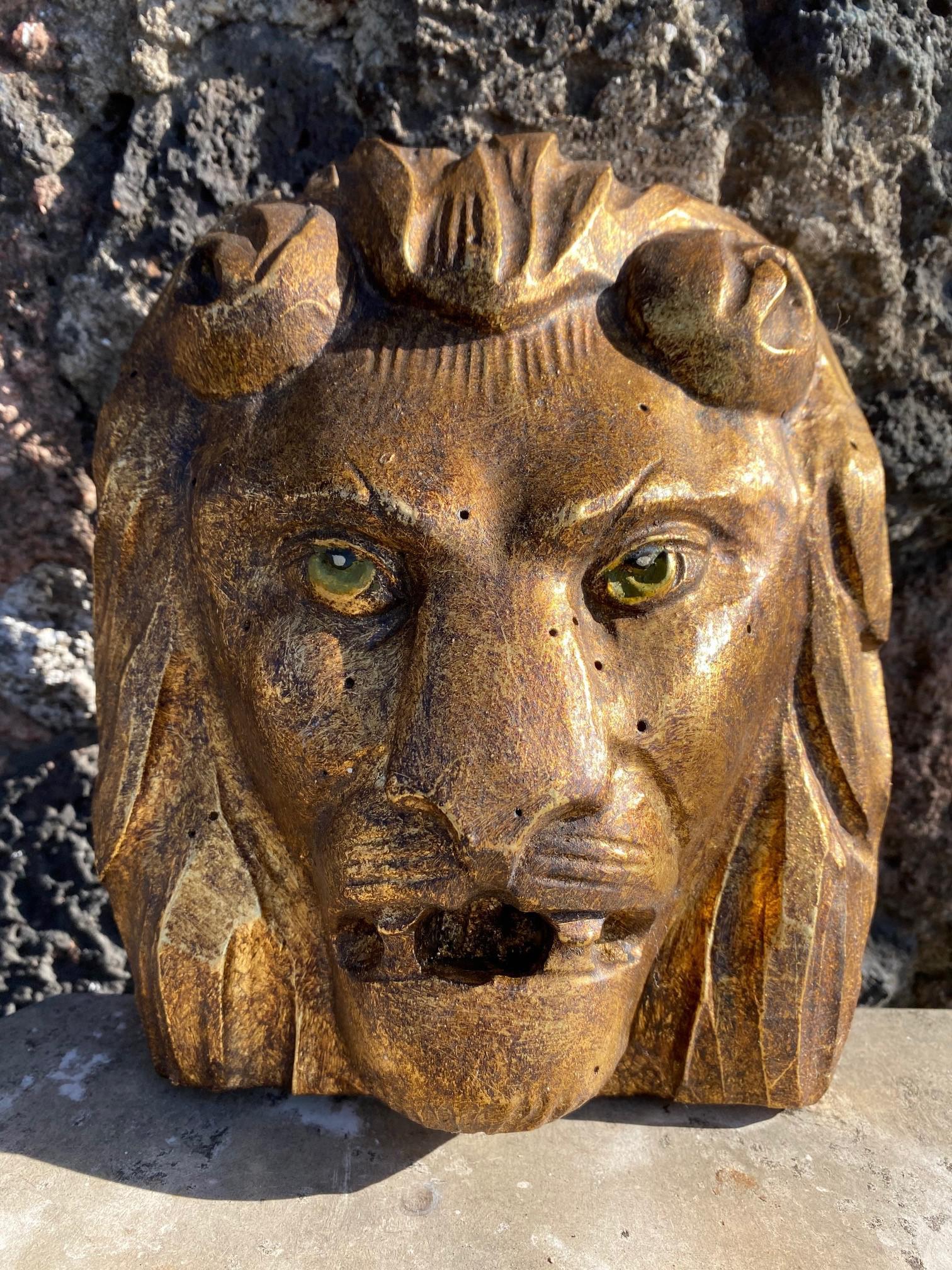 wooden lion head sculpture