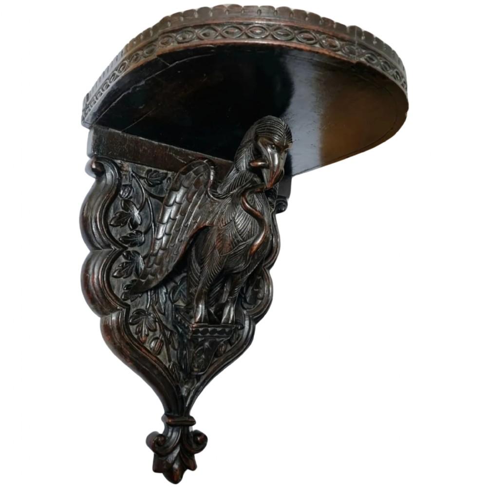 An extremely rare intricately carved 19th-century Anglo-Indian wall bracket or shelf. 

This exquisite piece is beautifully made . 

Intricately carved throughout with breathtaking detail . Featuring a realistically carved bird holding a snake in