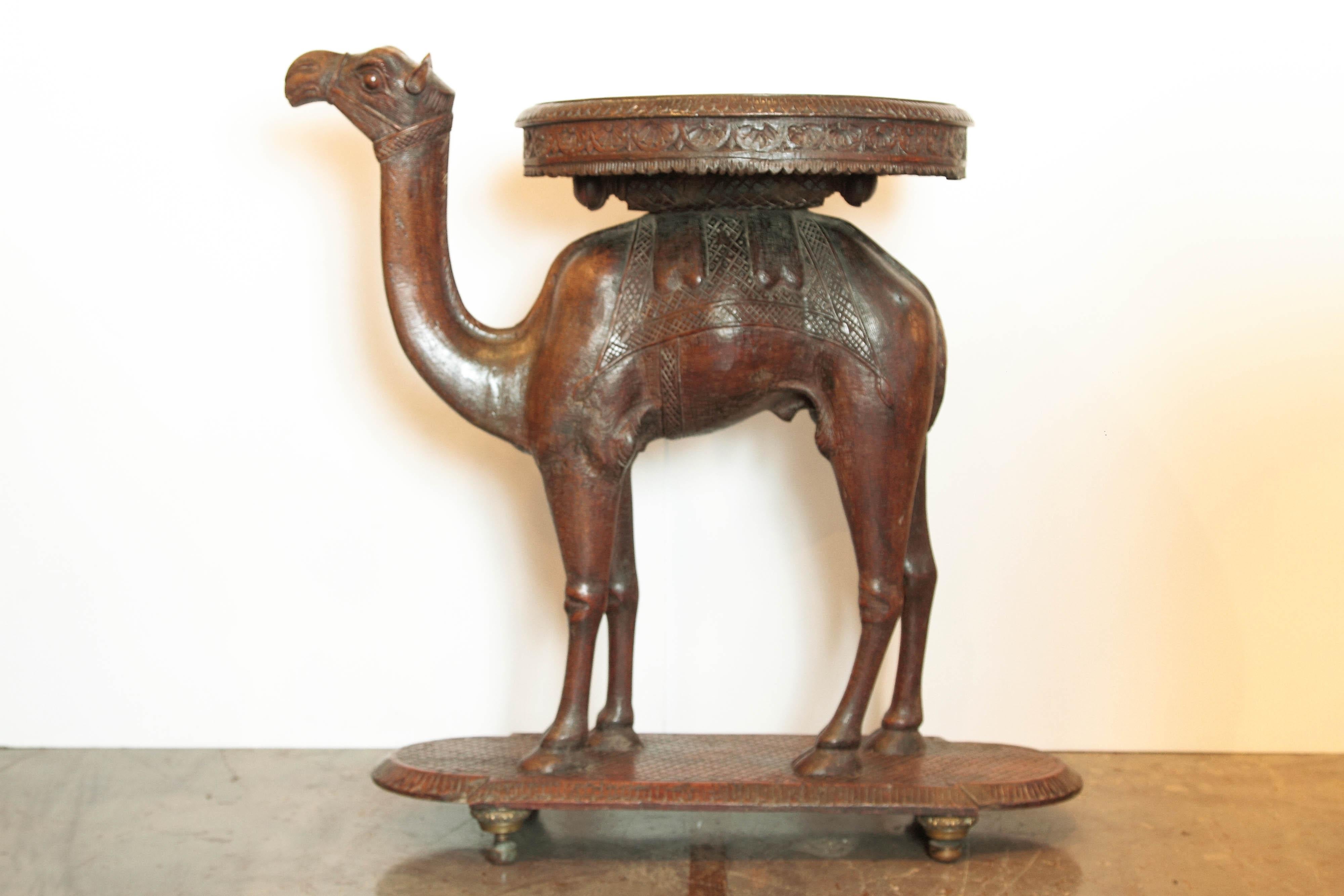 19th century Anglo-Indian carved camel table. Well defined excellent condition.