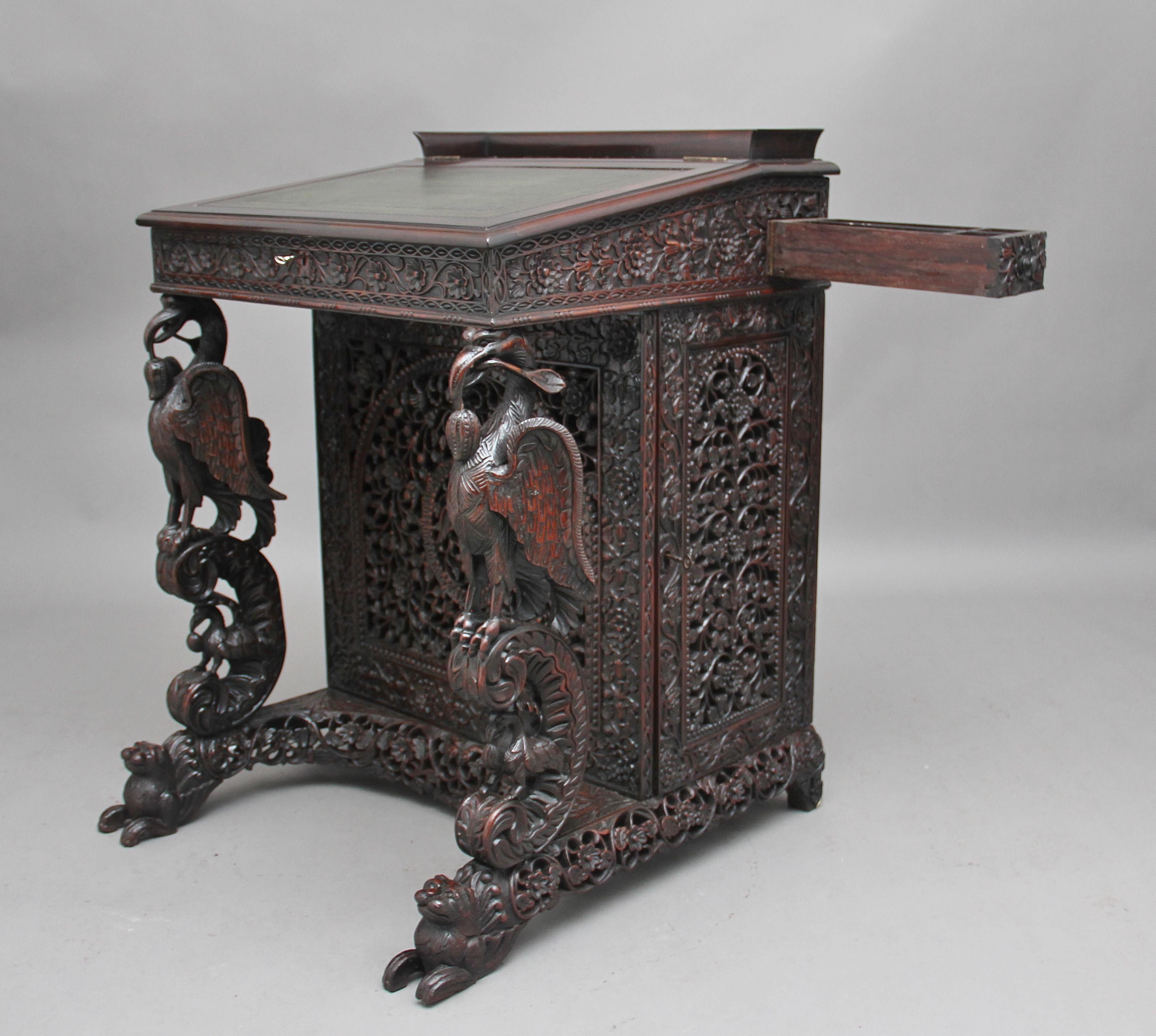 Teak 19th Century Anglo-Indian carved davenport with carved griffin supports