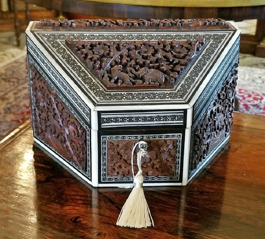 Lovely Anglo-Indian carved Padouk wood, faux ivory and sadeli mosaic stationary box.
Made in Bombay, India in the 19th century, circa 1880.

The box is constructed of sandalwood the covered in bone/faux ivory and carved Padouk panels depicting