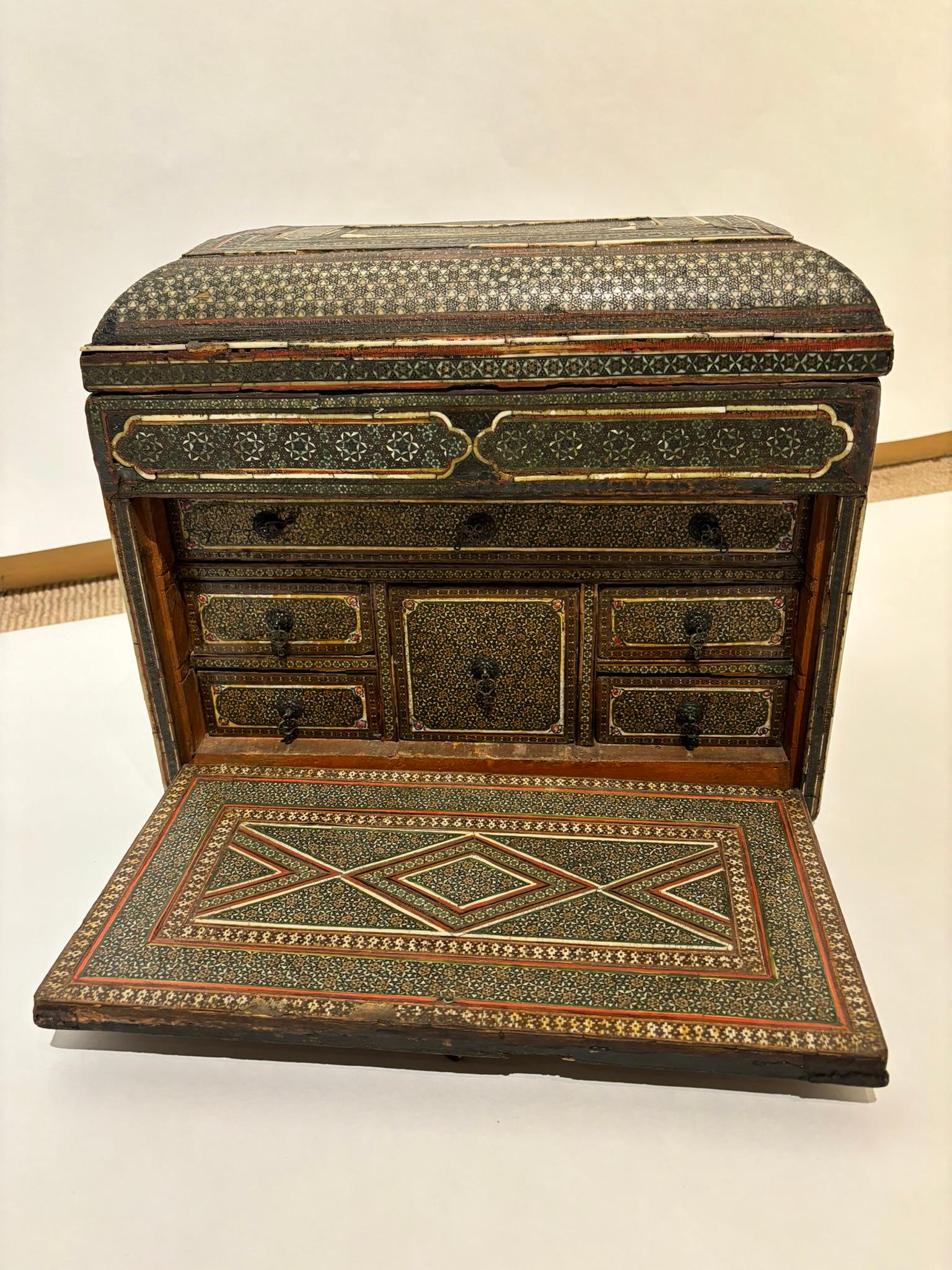 19th Century Anglo Indian fall front box with six drawers with metal pulls. The exterior and interior inlaid throughout with bone and various woods. Intricate geometric designs cover this lovely box, it is hard to conceive of all the hours of