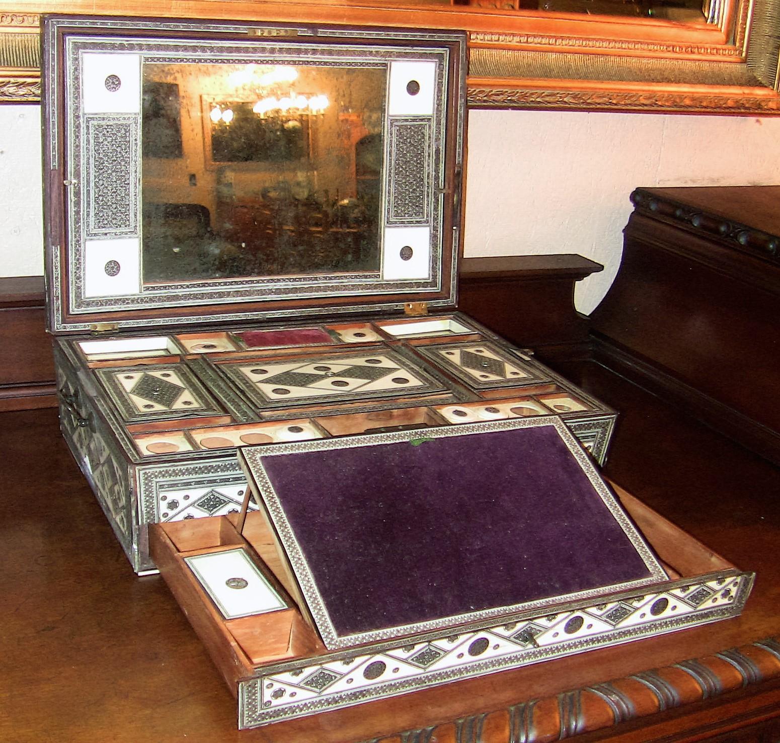 Gorgeous and extremely rare example of an Anglo-Indian Sadeli Mosaic Box from circa 1840.

Made in or around Bombay, India. This is a sarcophagus shaped sandalwood box encased in faux ivory and Bombay Sadeli Mosaic.

This is a style of mosaic