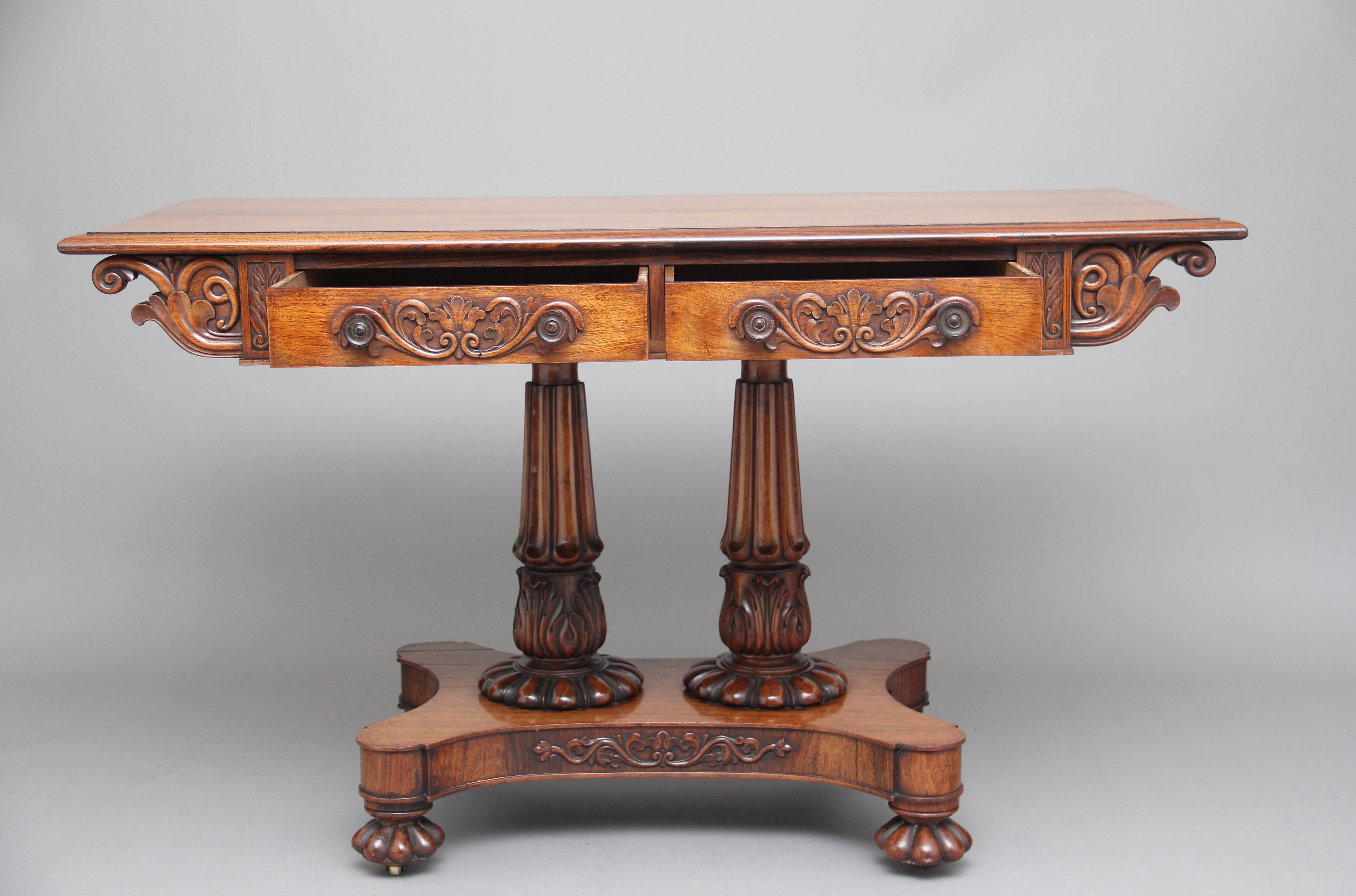 19th century Anglo-Indian teak sofa / writing table, the moulded edge top above two oak lined drawers with wonderfully carved floral decoration on the drawer fronts, original turned wooden knob handles, either side having carved leaf corner