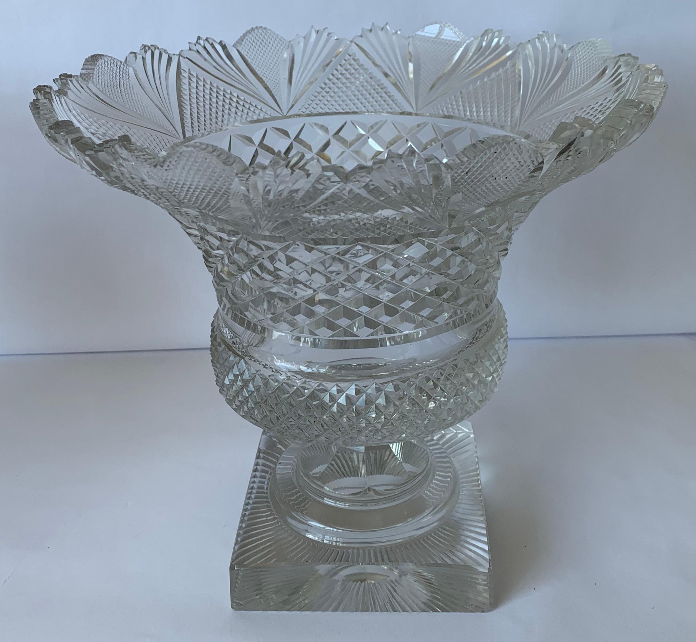 19th century Anglo-Irish cut crystal footed bowl. Alternating cut prisms with excellent cutting throughout. Round stepped base on square plinth. No makers mark or signature.