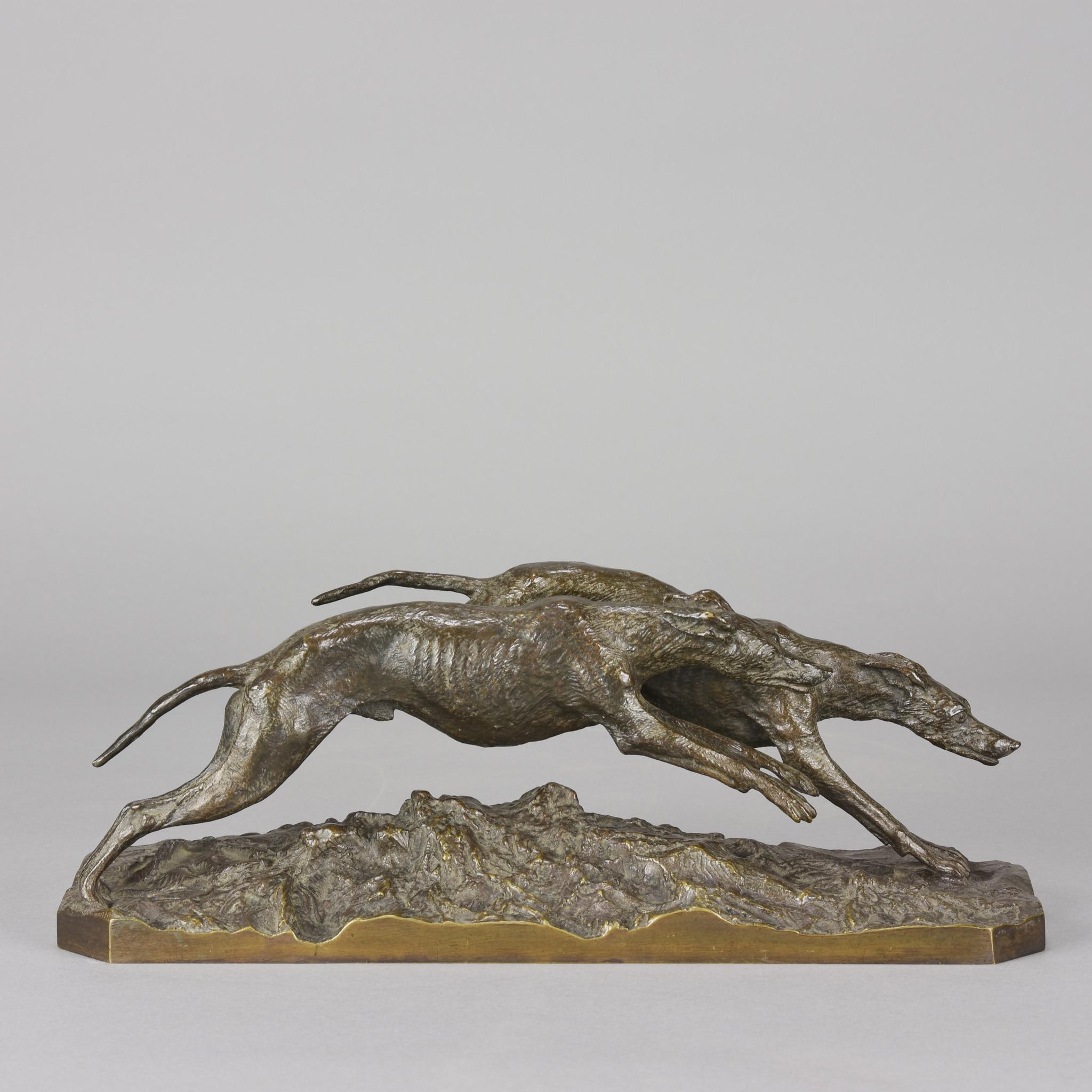 A fabulous Animalier bronze group of two racing greyhounds with excellent hand chased surface detail and appealing lightly worn golden brown patina, raised on a highly detailed naturalistic base, signed FRATIN. 
ADDITIONAL INFORMATION

Height: 11