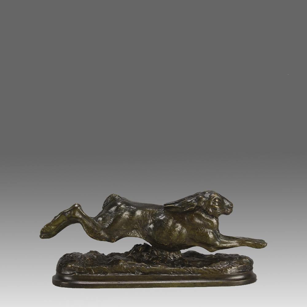 Une fabuleuse étude en bronze animalier de la fin du 19e siècle représentant un lièvre énergique bondissant dans un paysage naturaliste, présentant une excellente patine riche en vert et en brun et de fins détails de surface ciselés à la main,