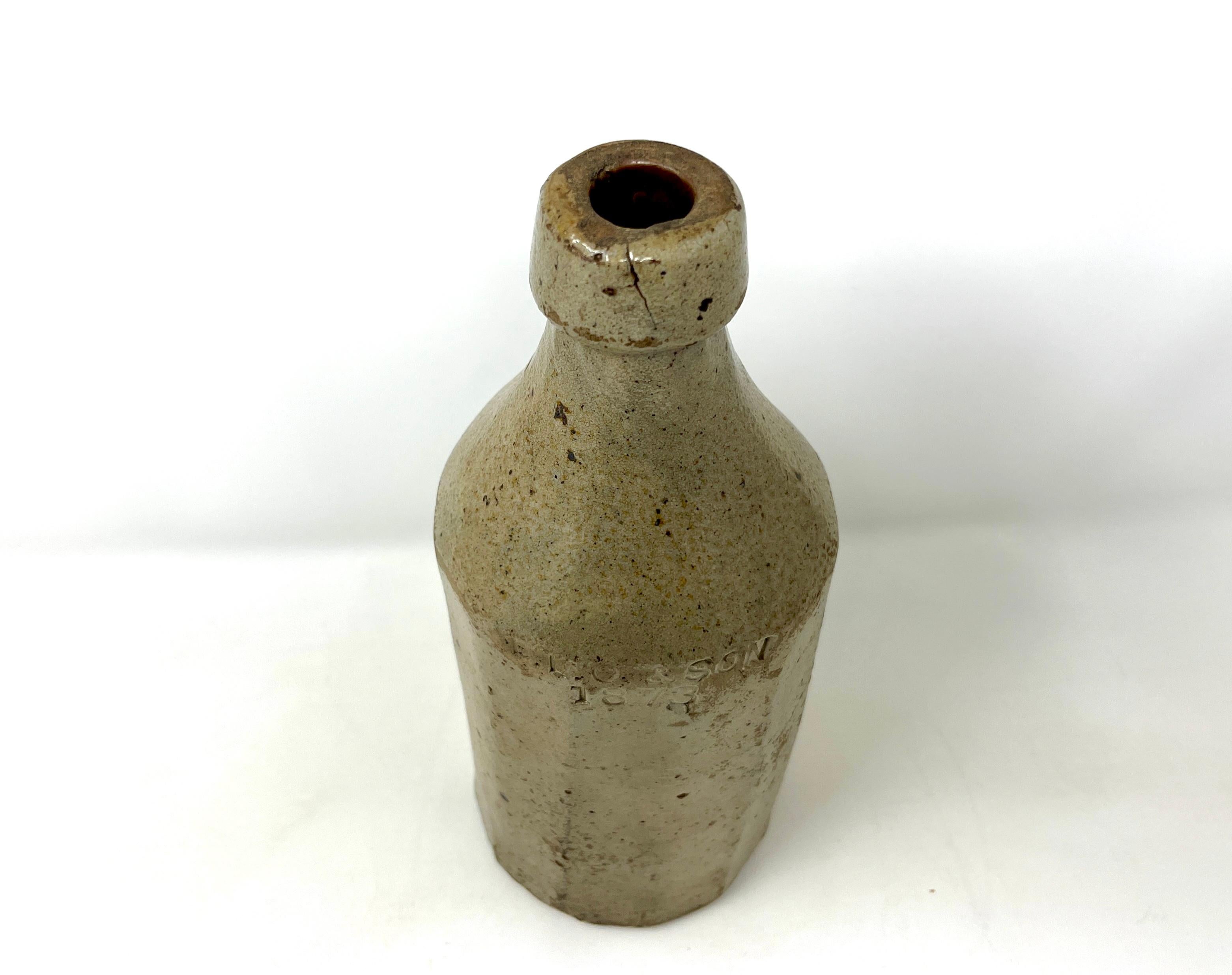 Early stoneware pottery beer/ale bottle marked D.L.O. & Son that is remarkable intact. Dorman Leonard Ormsby appears in the business directory for Manhattan, New York, at multiple addresses from 1861 to 1877. The bottling company produced mineral